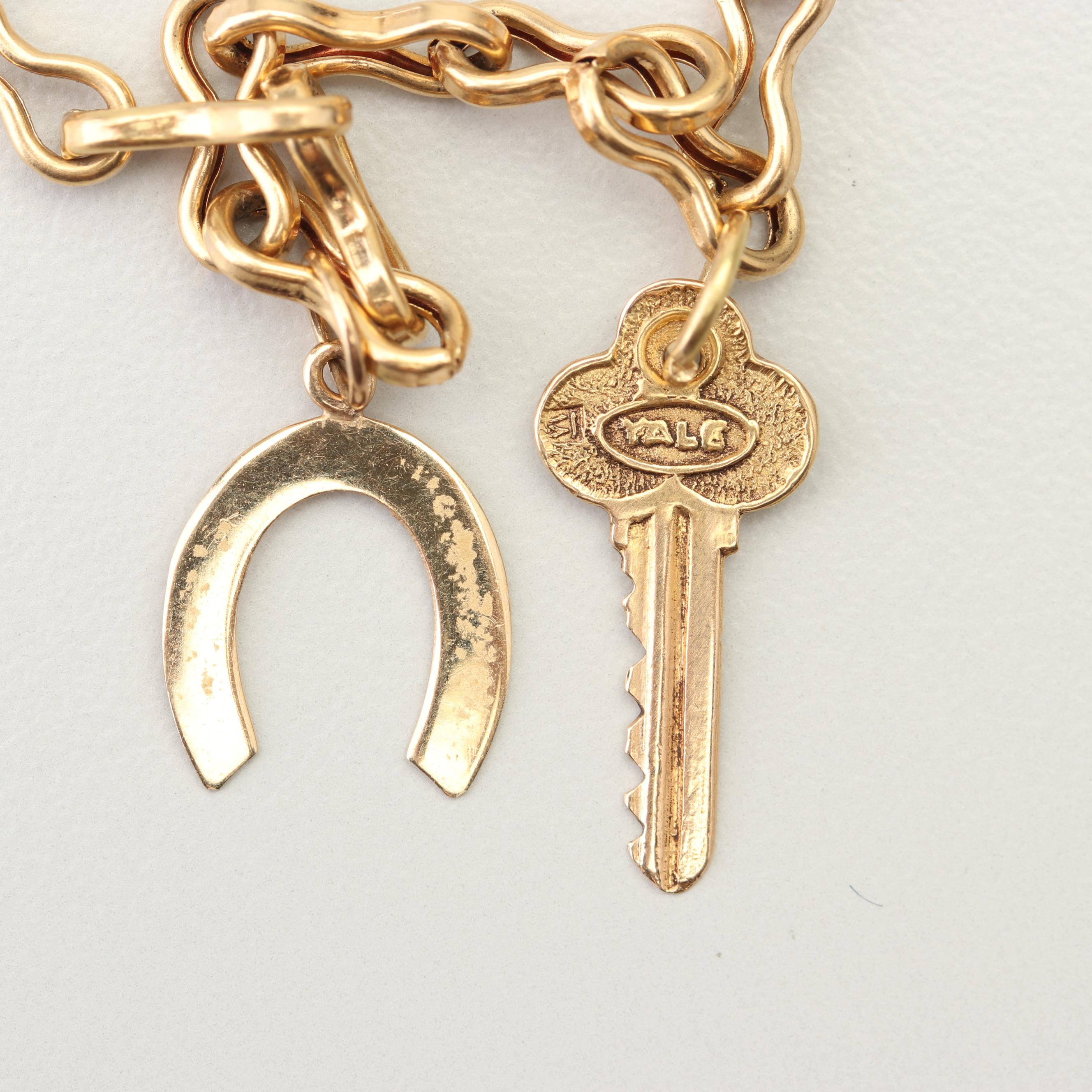 18K Yellow Gold Charm Bracelet with 14K and 10K Yellow Gold Charms