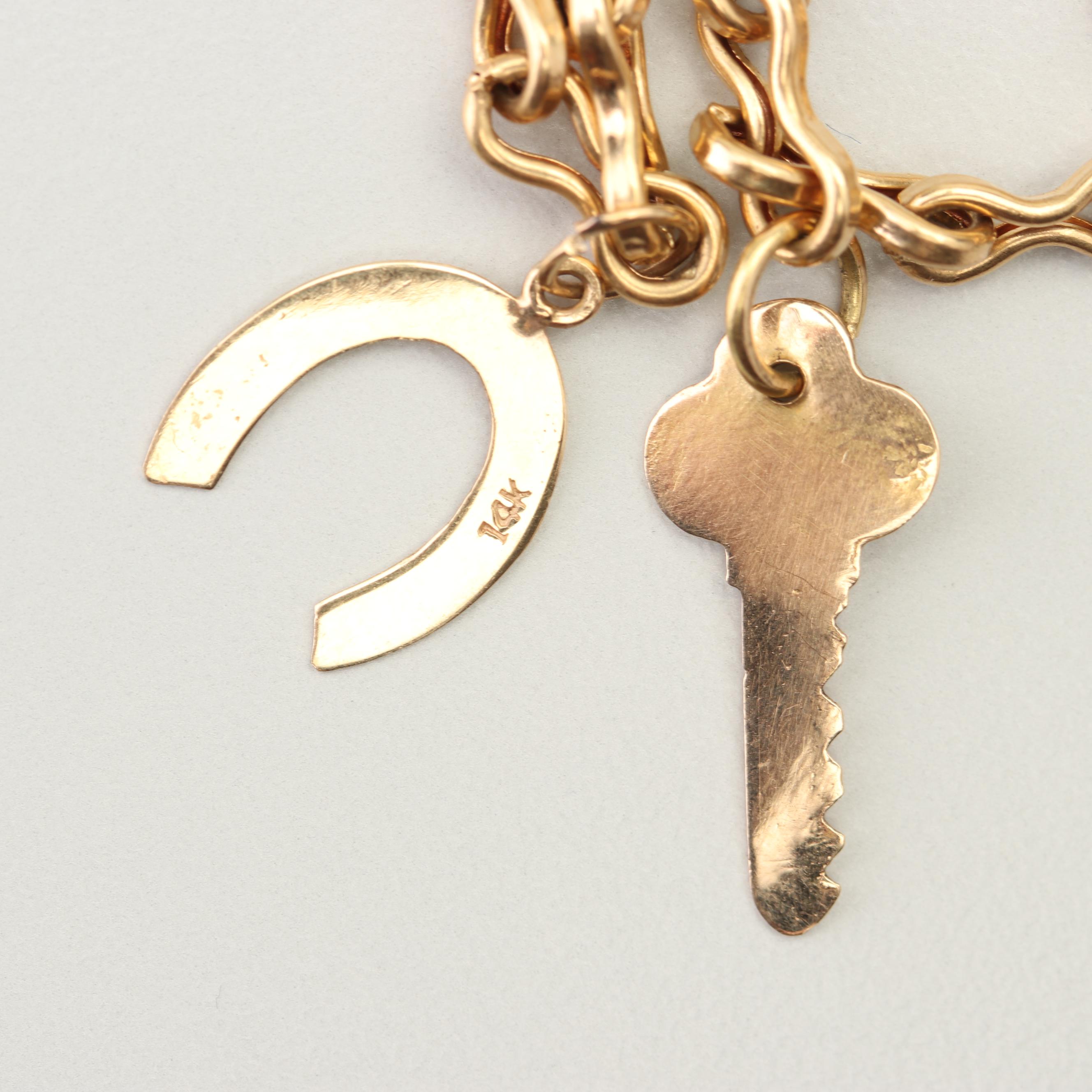 18K Yellow Gold Charm Bracelet with 14K and 10K Yellow Gold Charms