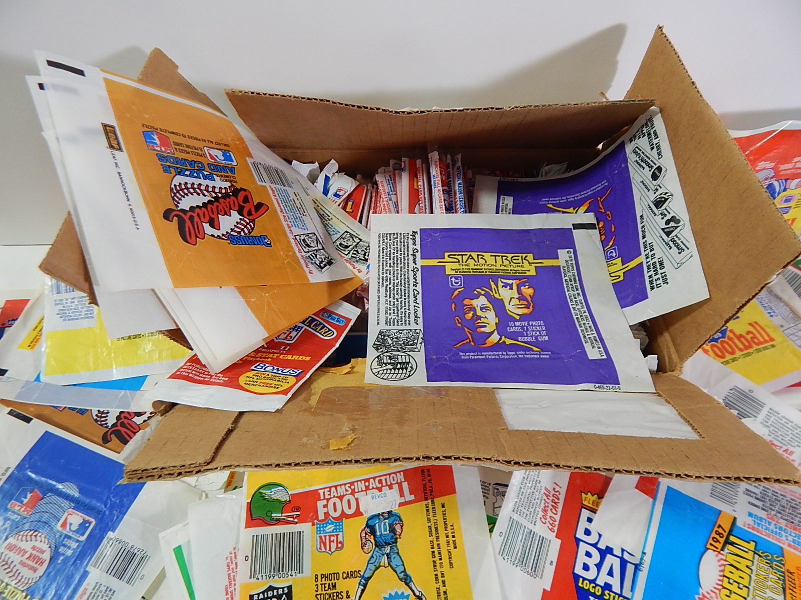 Hundreds of Wax Pack Wrappers with Sports and Non-Sports from 1980s