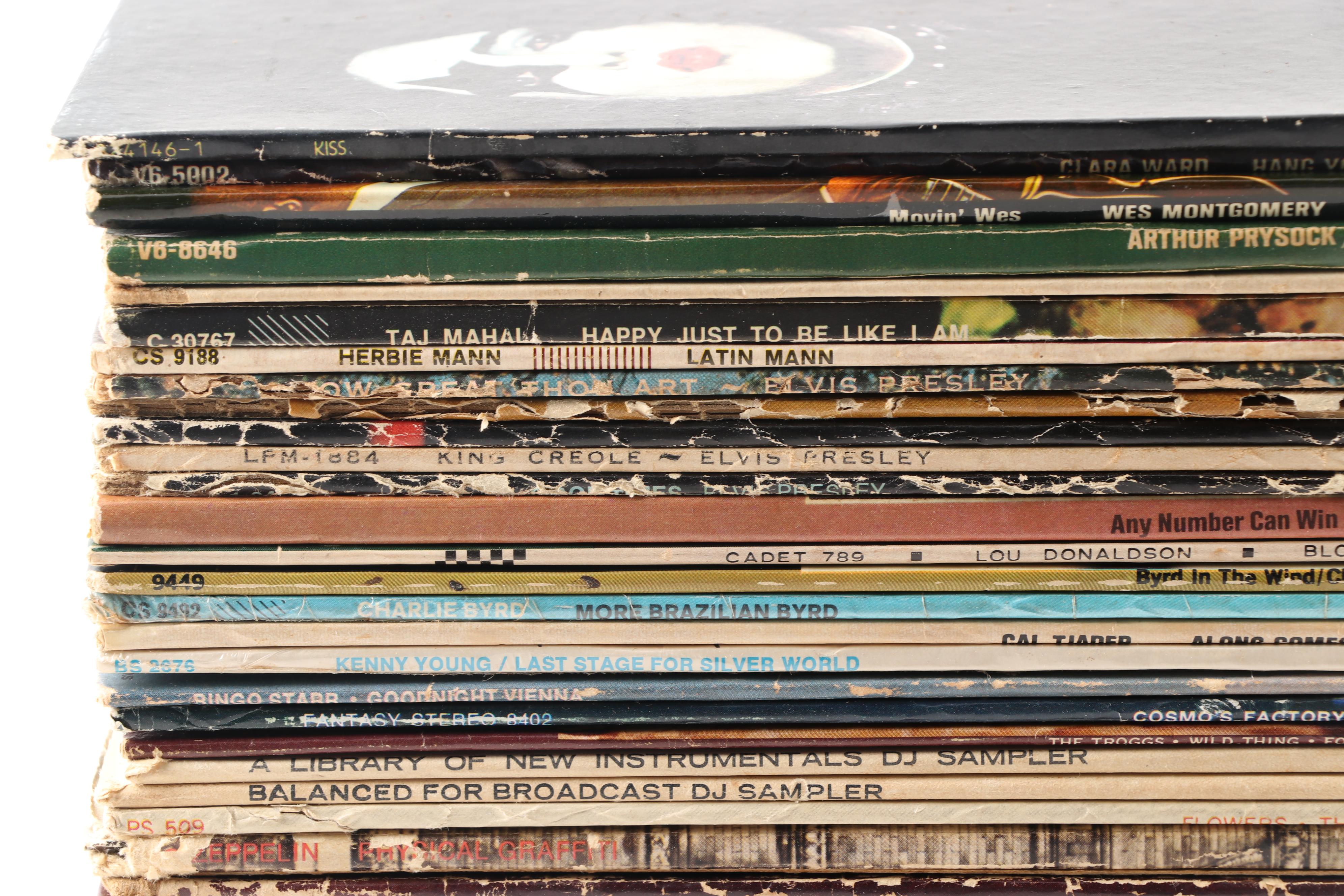 Rock LPs including Meat Loaf, Jimi Hendrix, Elvis, The Doors, and Kiss