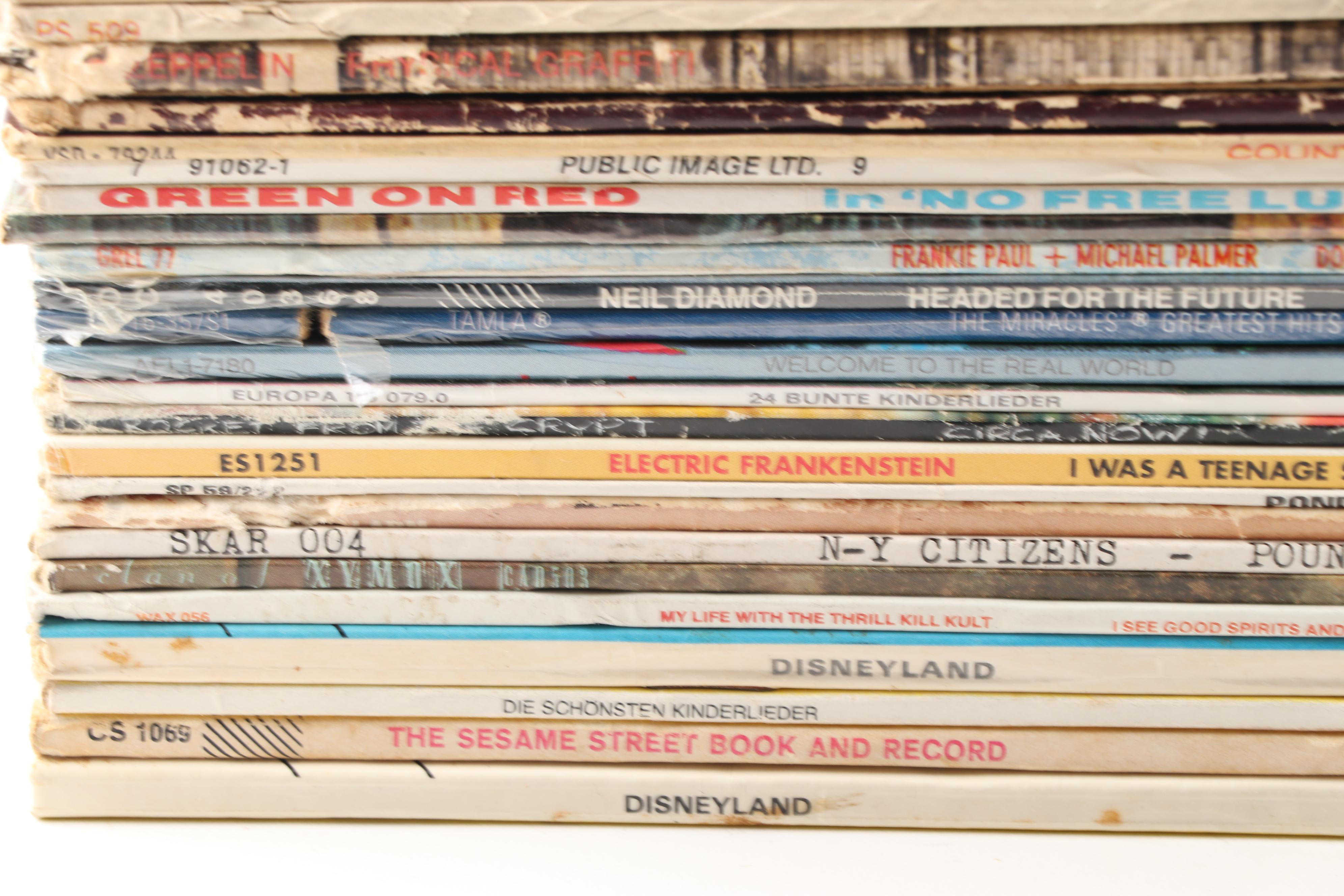 Rock LPs including Meat Loaf, Jimi Hendrix, Elvis, The Doors, and Kiss