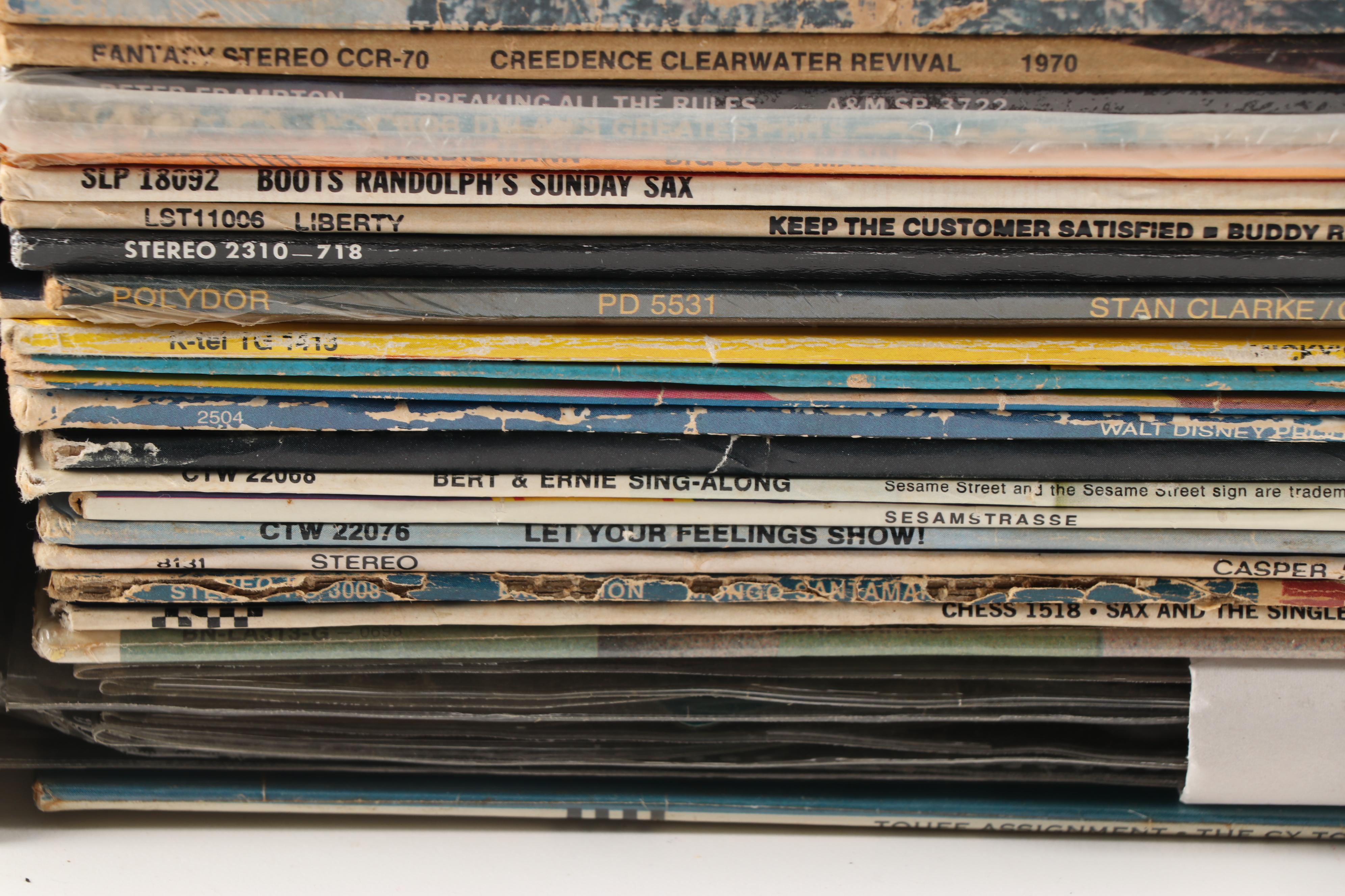 Rock LPs including Meat Loaf, Jimi Hendrix, Elvis, The Doors, and Kiss