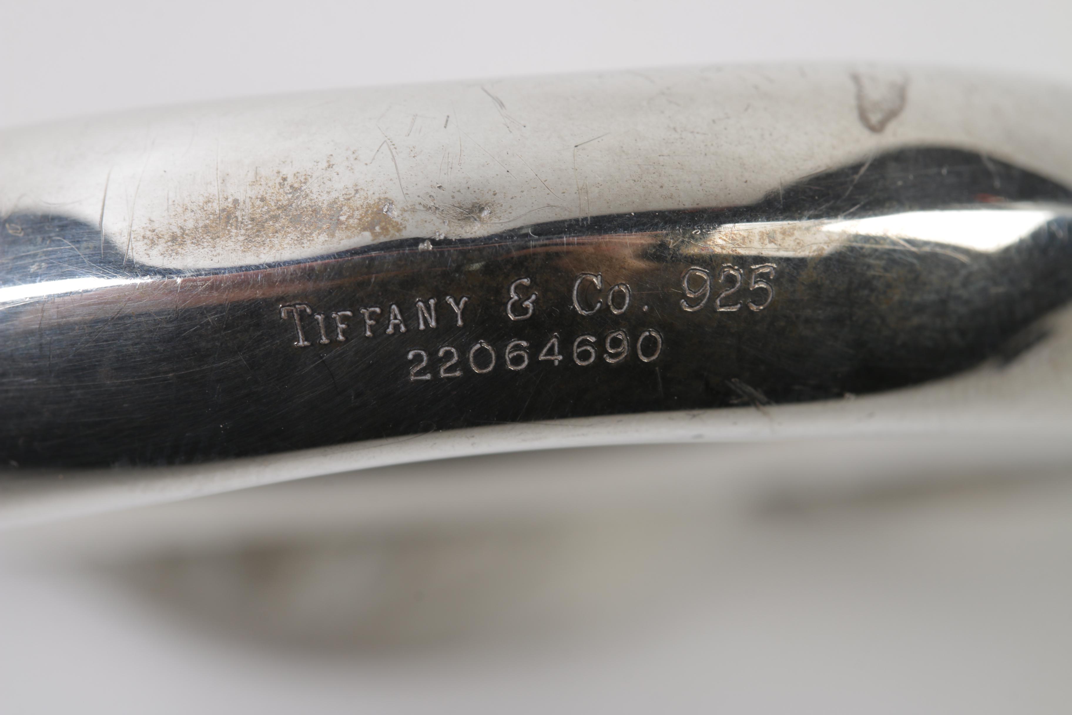 Tiffany & Co. Sterling "Man on the Moon" and "Rolling Swing Bear" Baby Rattles