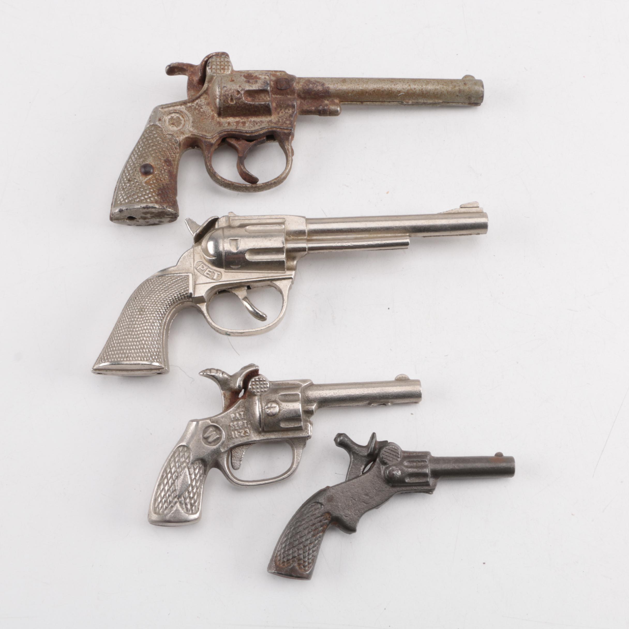 "Pluck", "Pet", "Bronco" and "Jax" Cast Iron Toy Revolvers, Mid-Century