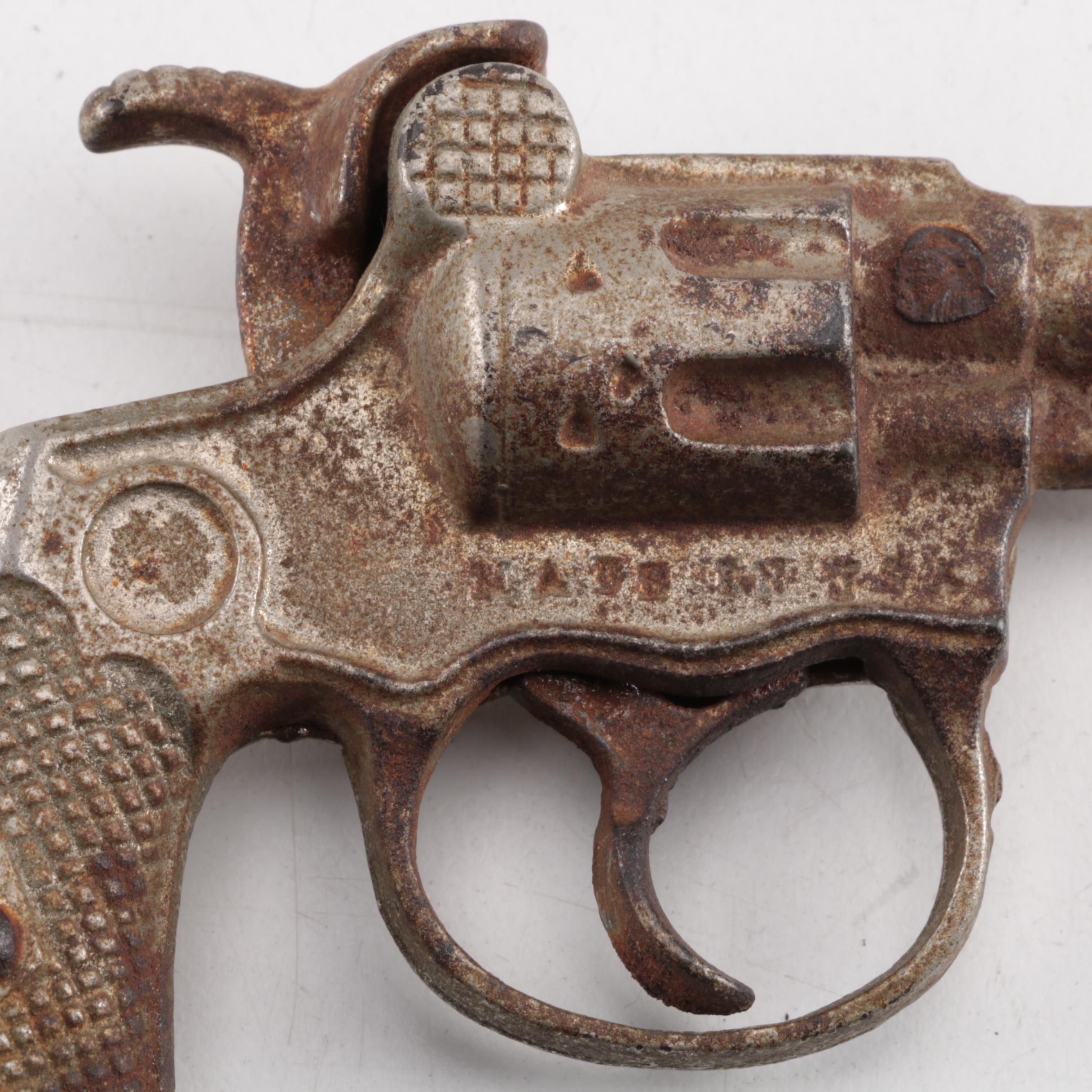 "Pluck", "Pet", "Bronco" and "Jax" Cast Iron Toy Revolvers, Mid-Century