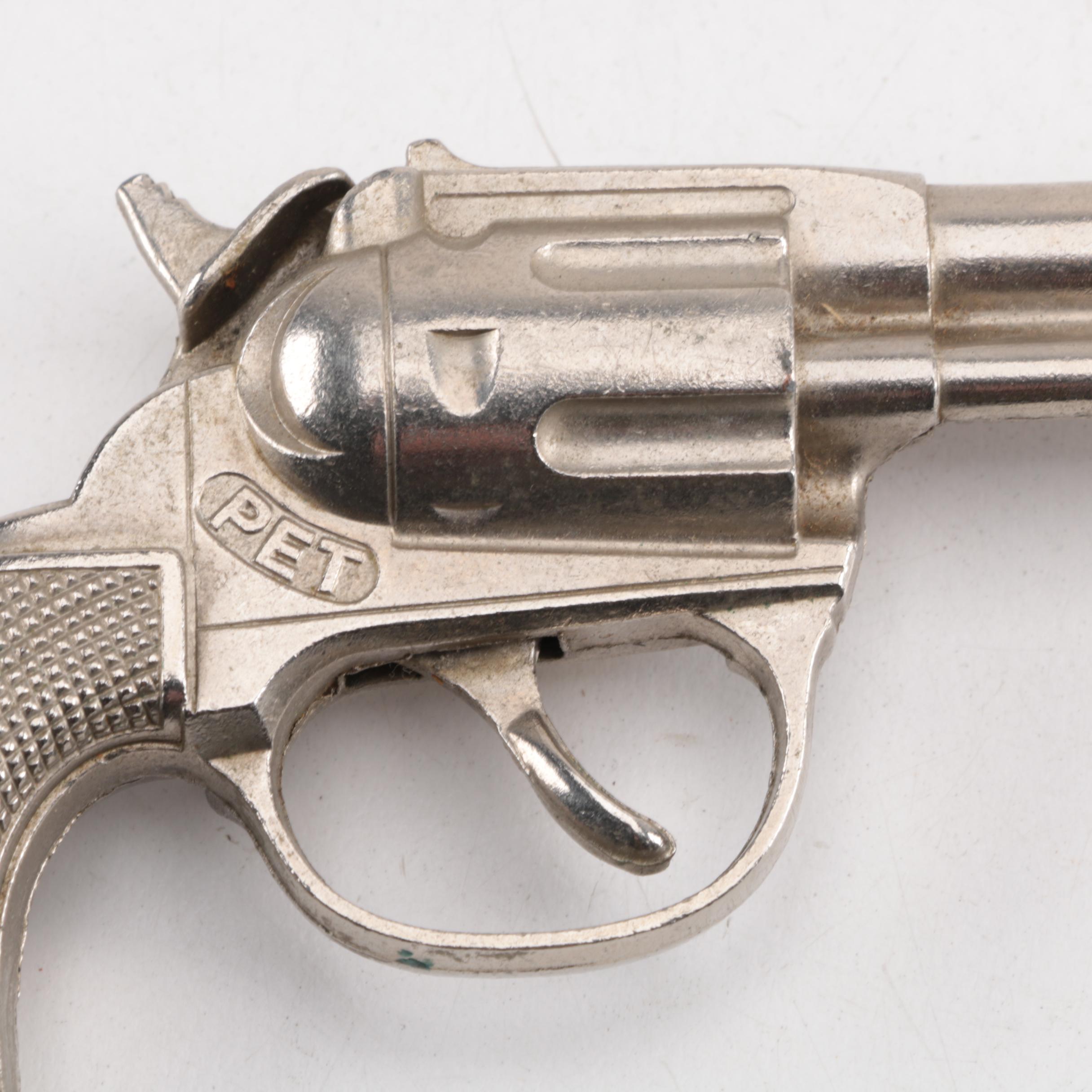 "Pluck", "Pet", "Bronco" and "Jax" Cast Iron Toy Revolvers, Mid-Century