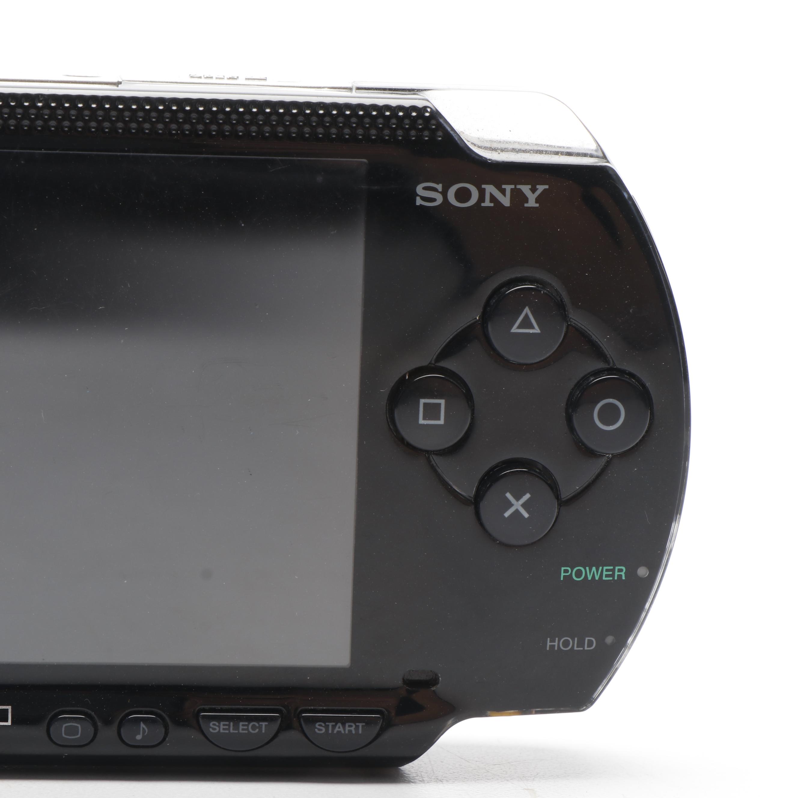 Sony Black Playstation Portable and Collection of PSP Video Games