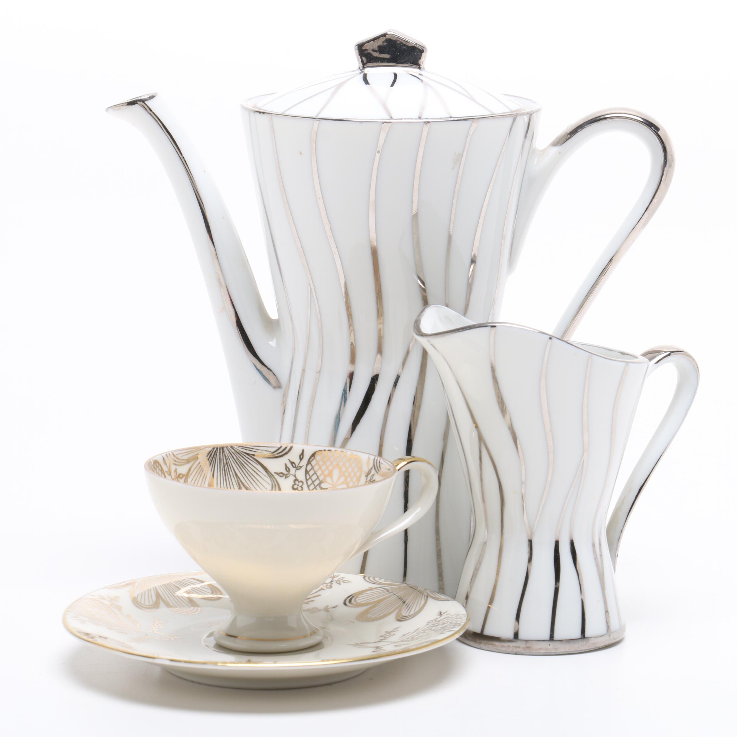 Teapot, Creamer, and Teacup with Saucer