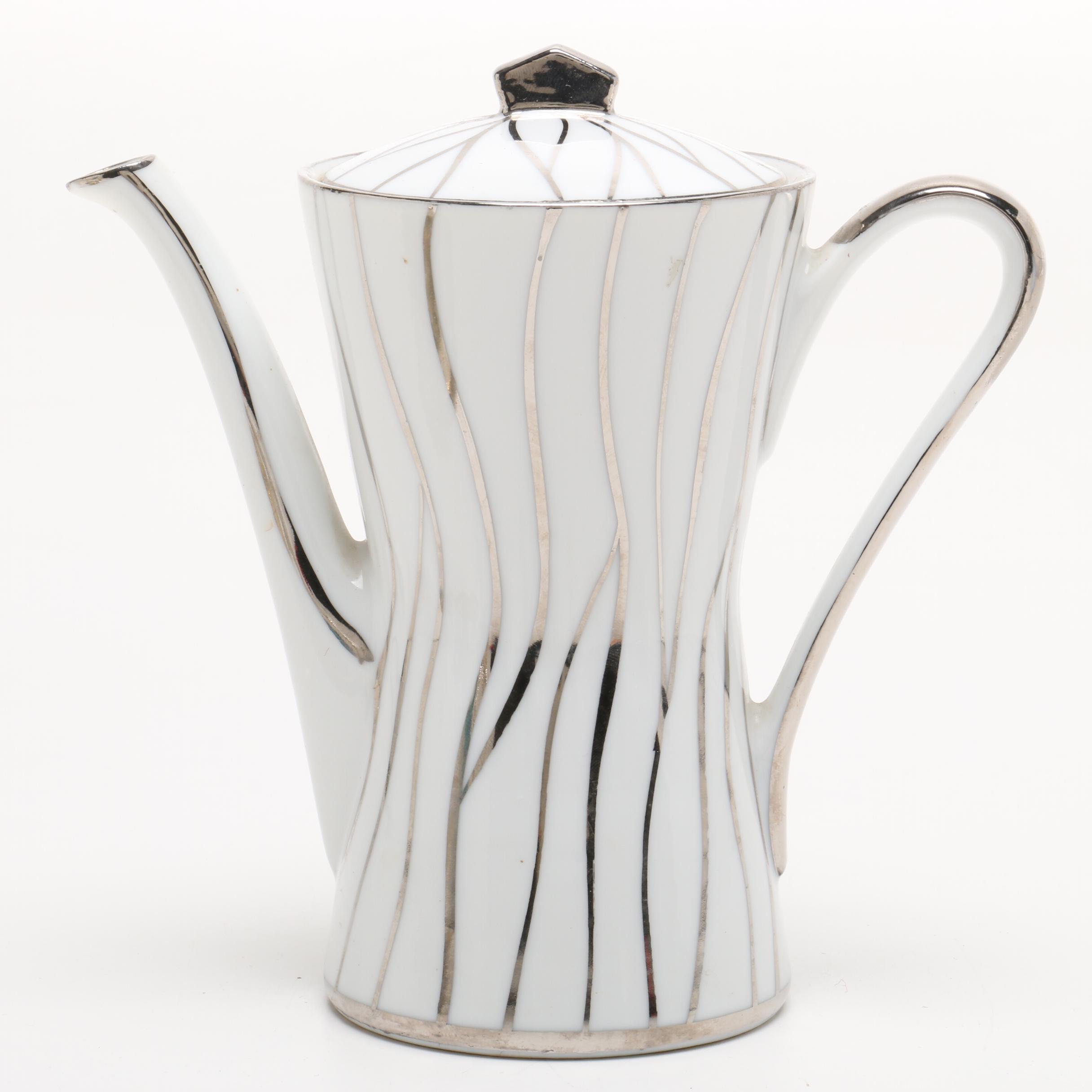 Teapot, Creamer, and Teacup with Saucer