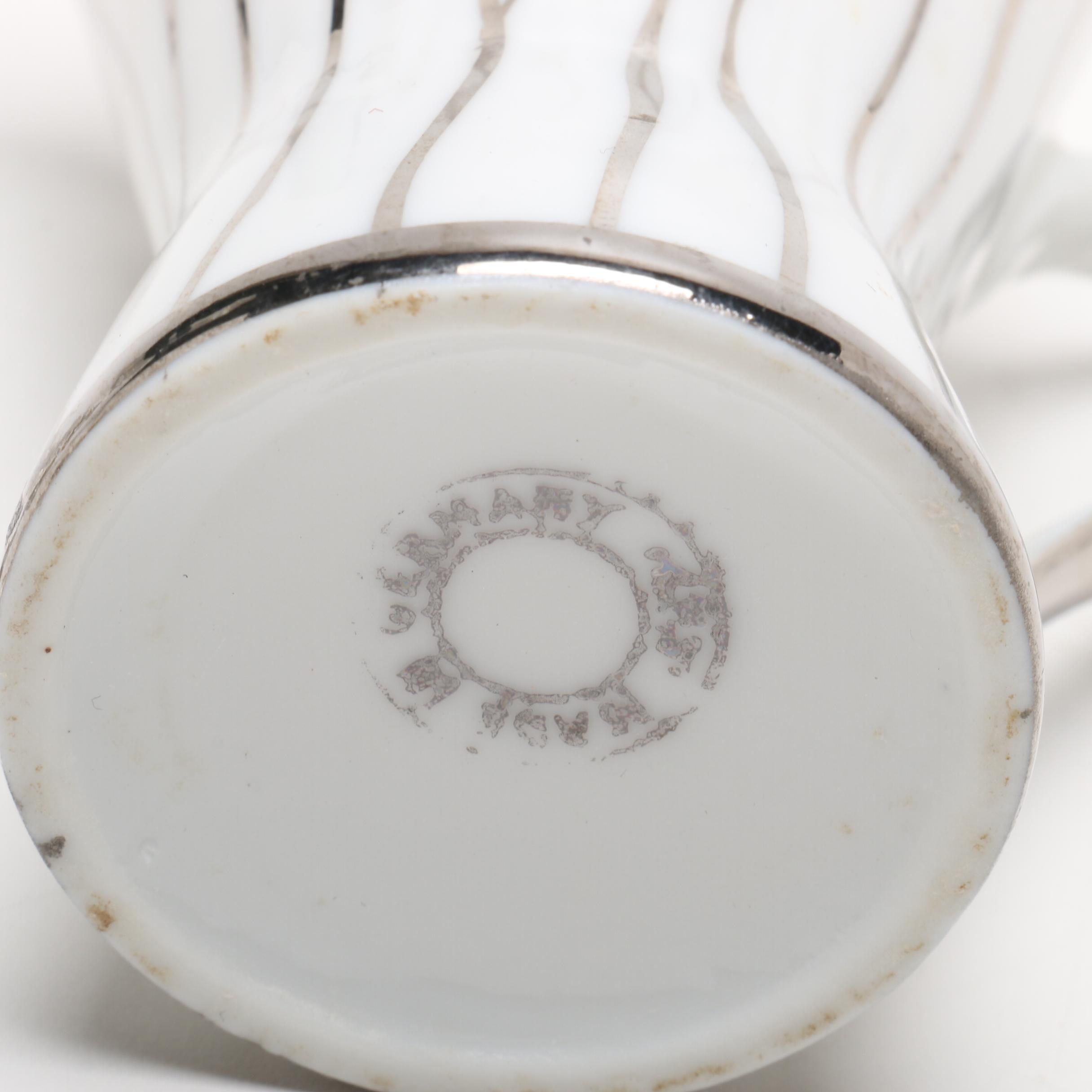 Teapot, Creamer, and Teacup with Saucer