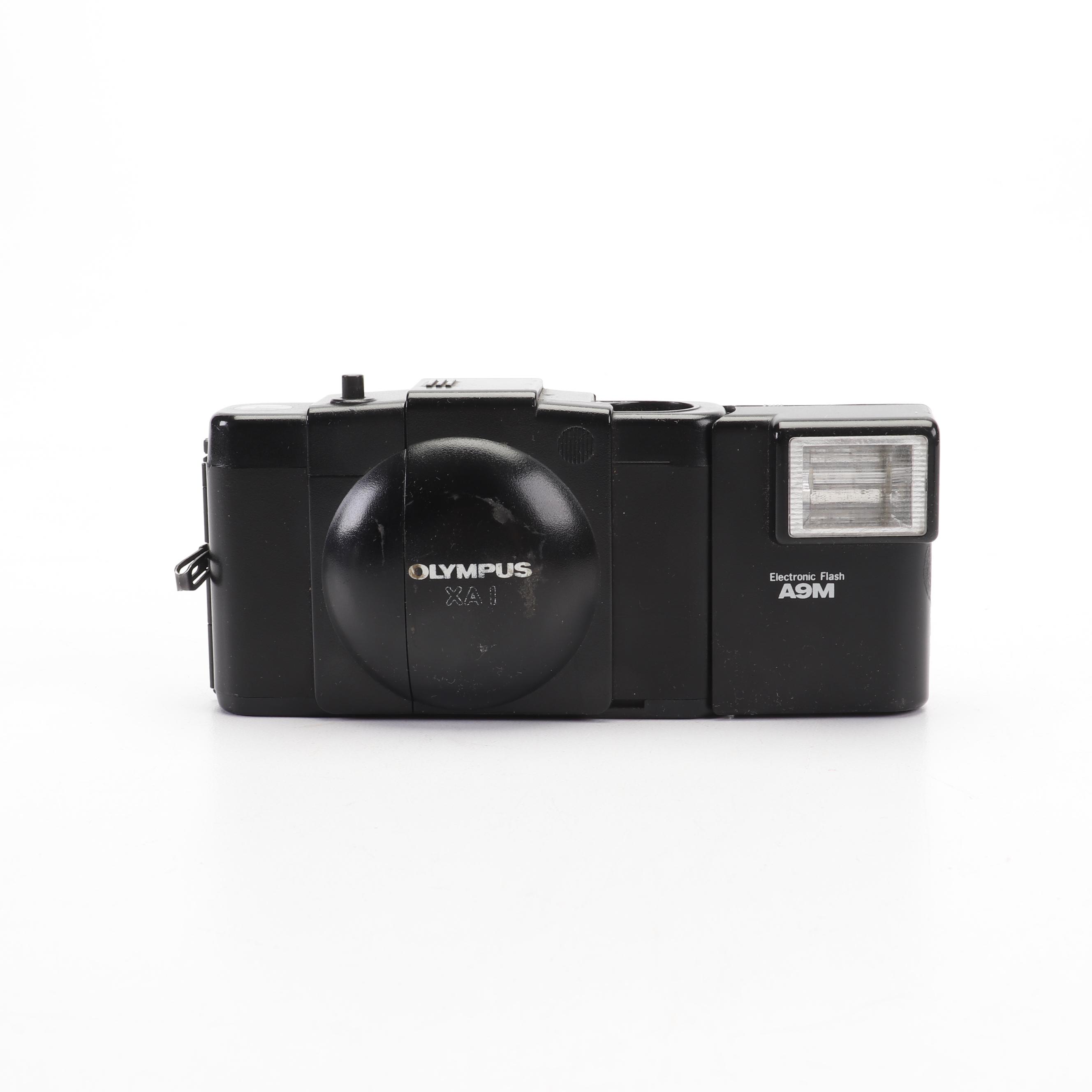 Olympus and Pentax Compact Cameras