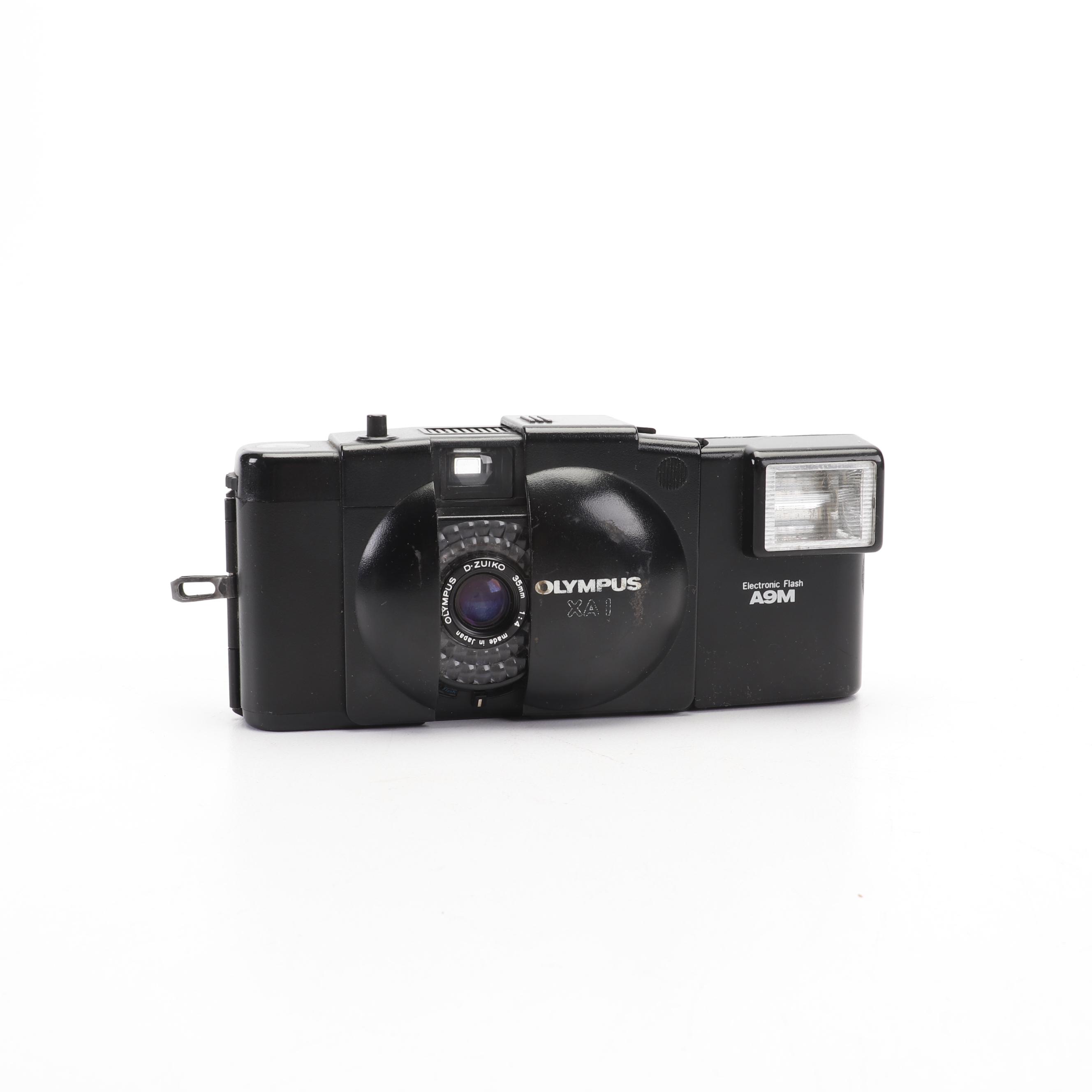 Olympus and Pentax Compact Cameras