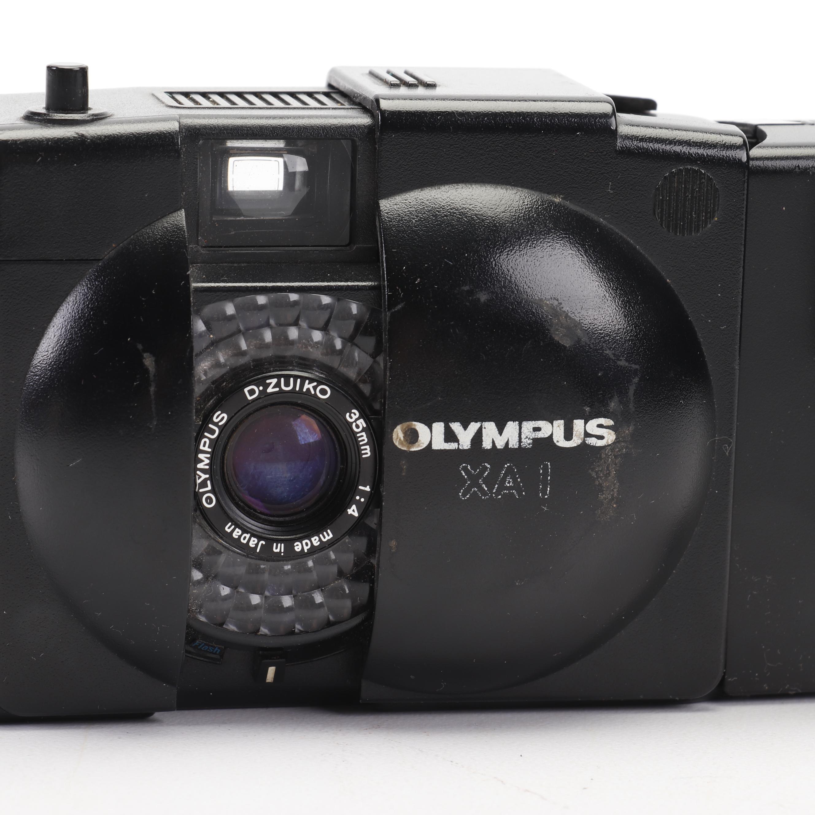 Olympus and Pentax Compact Cameras