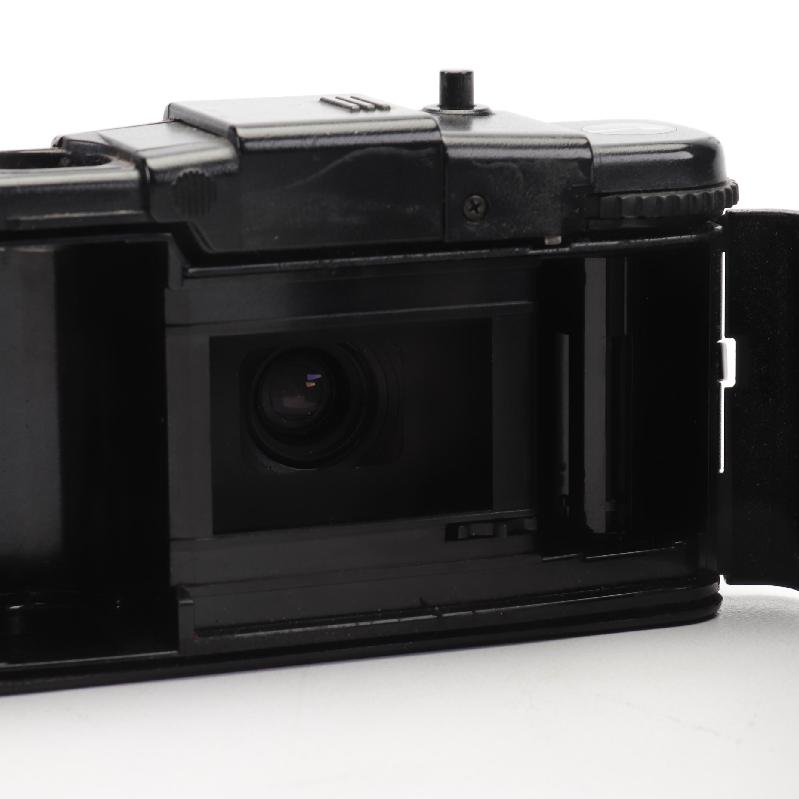 Olympus and Pentax Compact Cameras