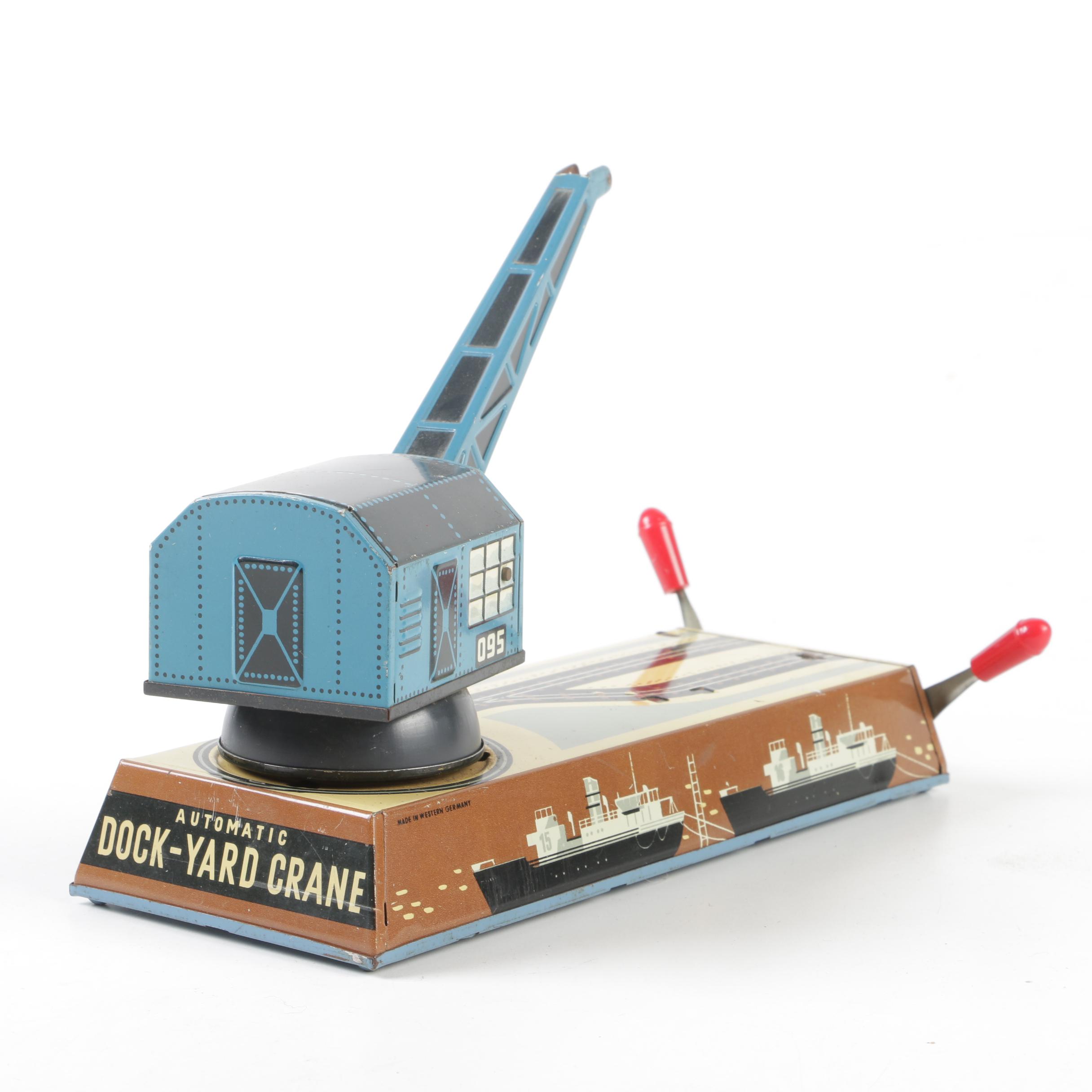 Biller Tin Litho Wind-Up Dockyard Crane and West Bros Co. Candy Cannon
