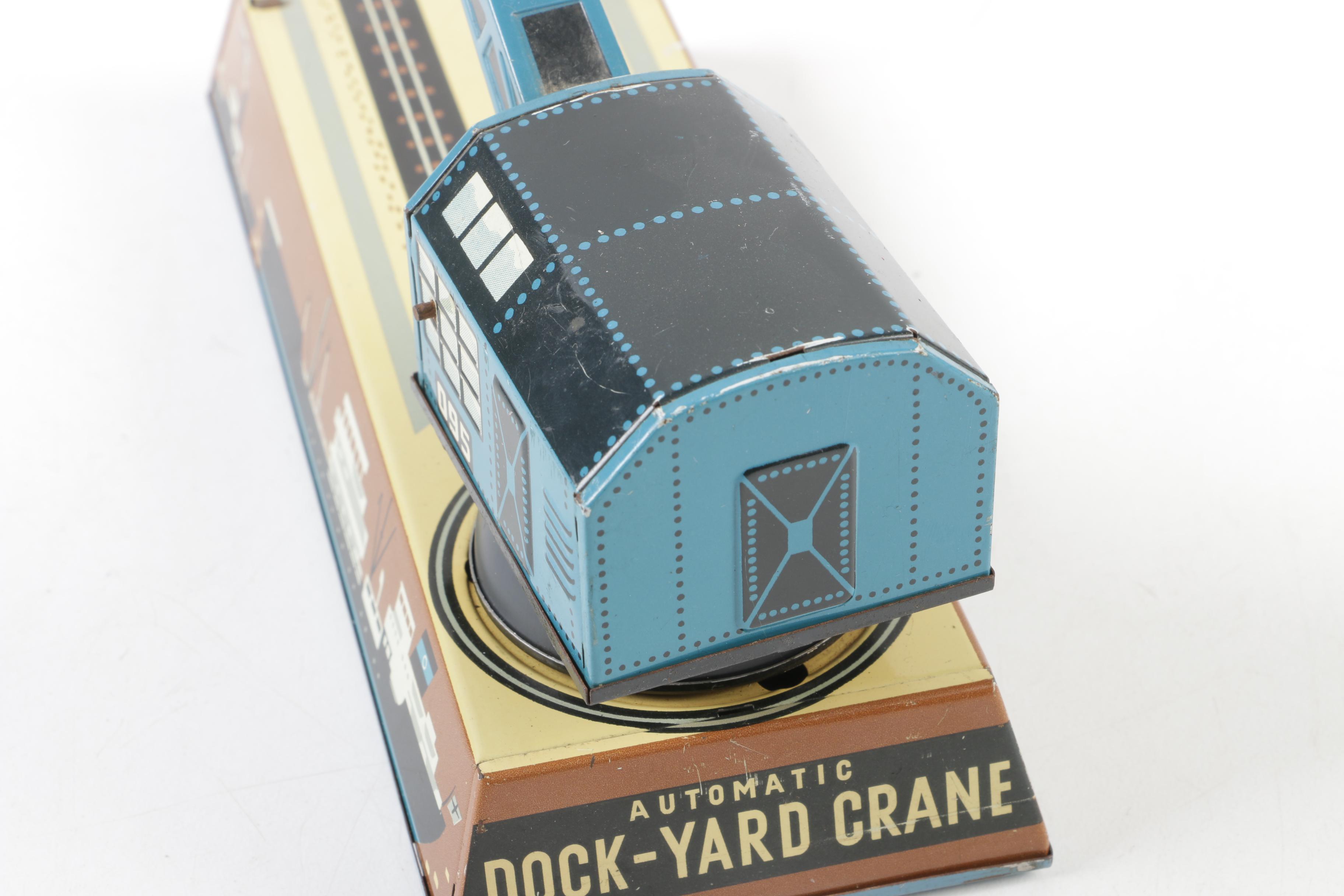 Biller Tin Litho Wind-Up Dockyard Crane and West Bros Co. Candy Cannon