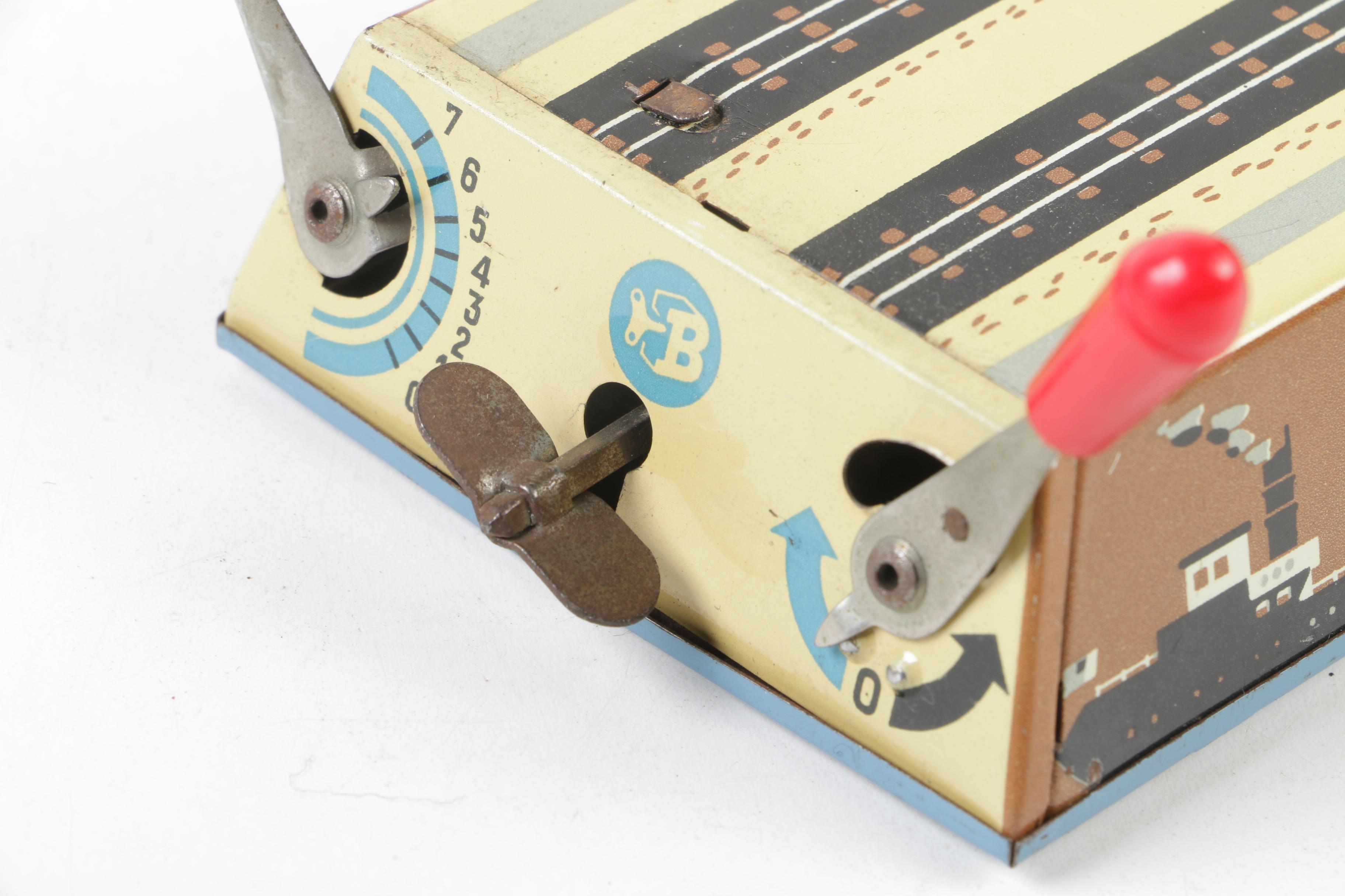 Biller Tin Litho Wind-Up Dockyard Crane and West Bros Co. Candy Cannon