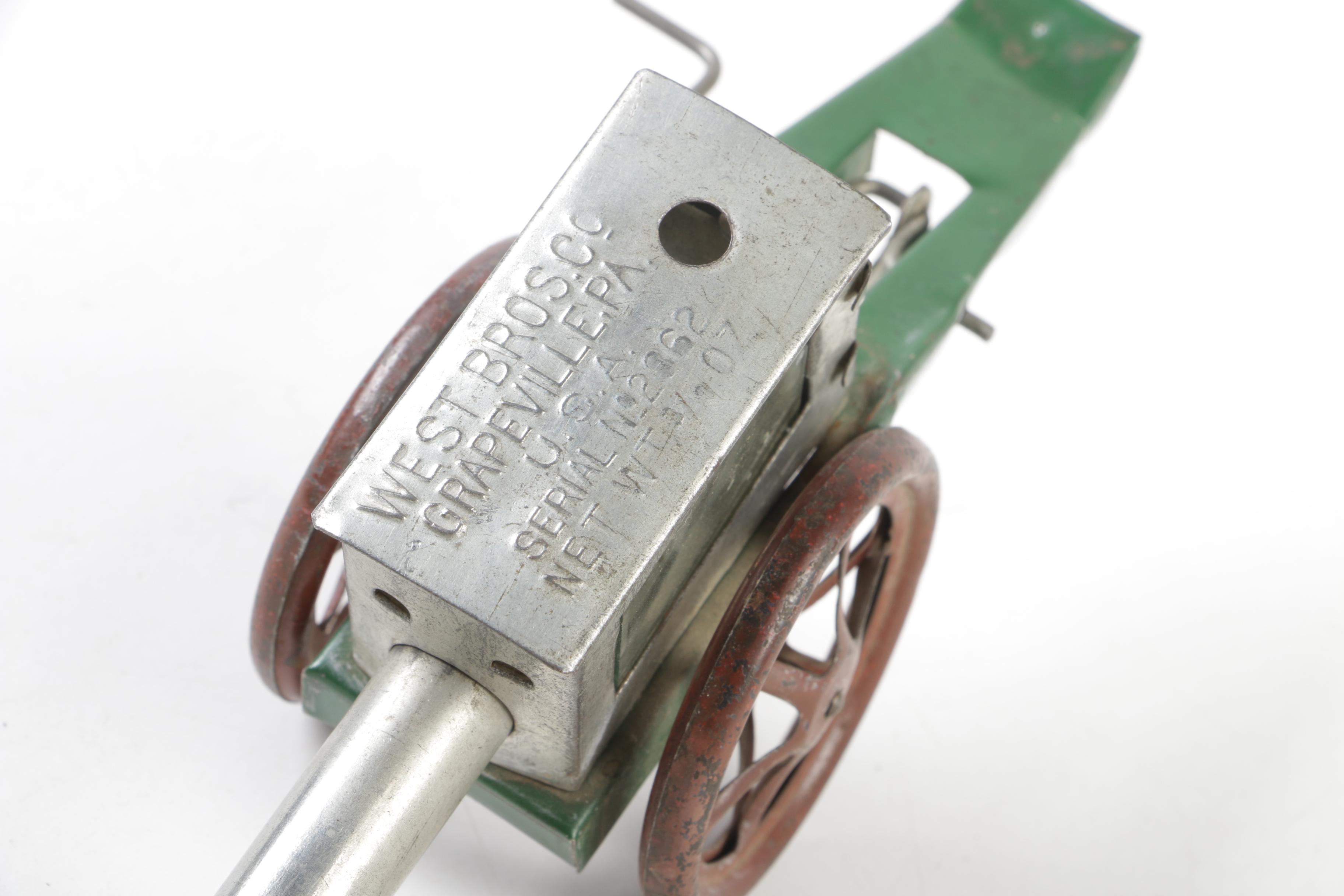 Biller Tin Litho Wind-Up Dockyard Crane and West Bros Co. Candy Cannon