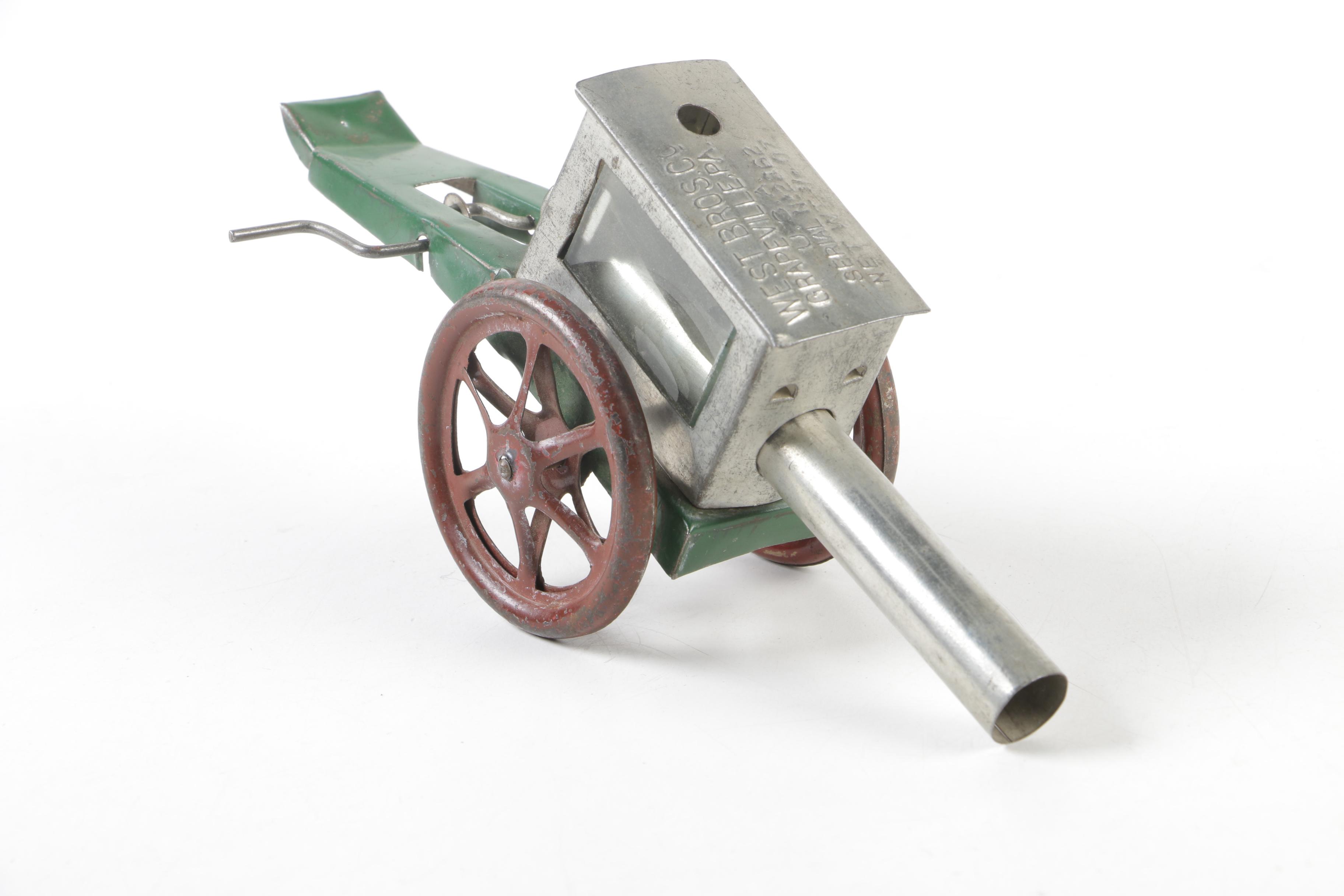 Biller Tin Litho Wind-Up Dockyard Crane and West Bros Co. Candy Cannon