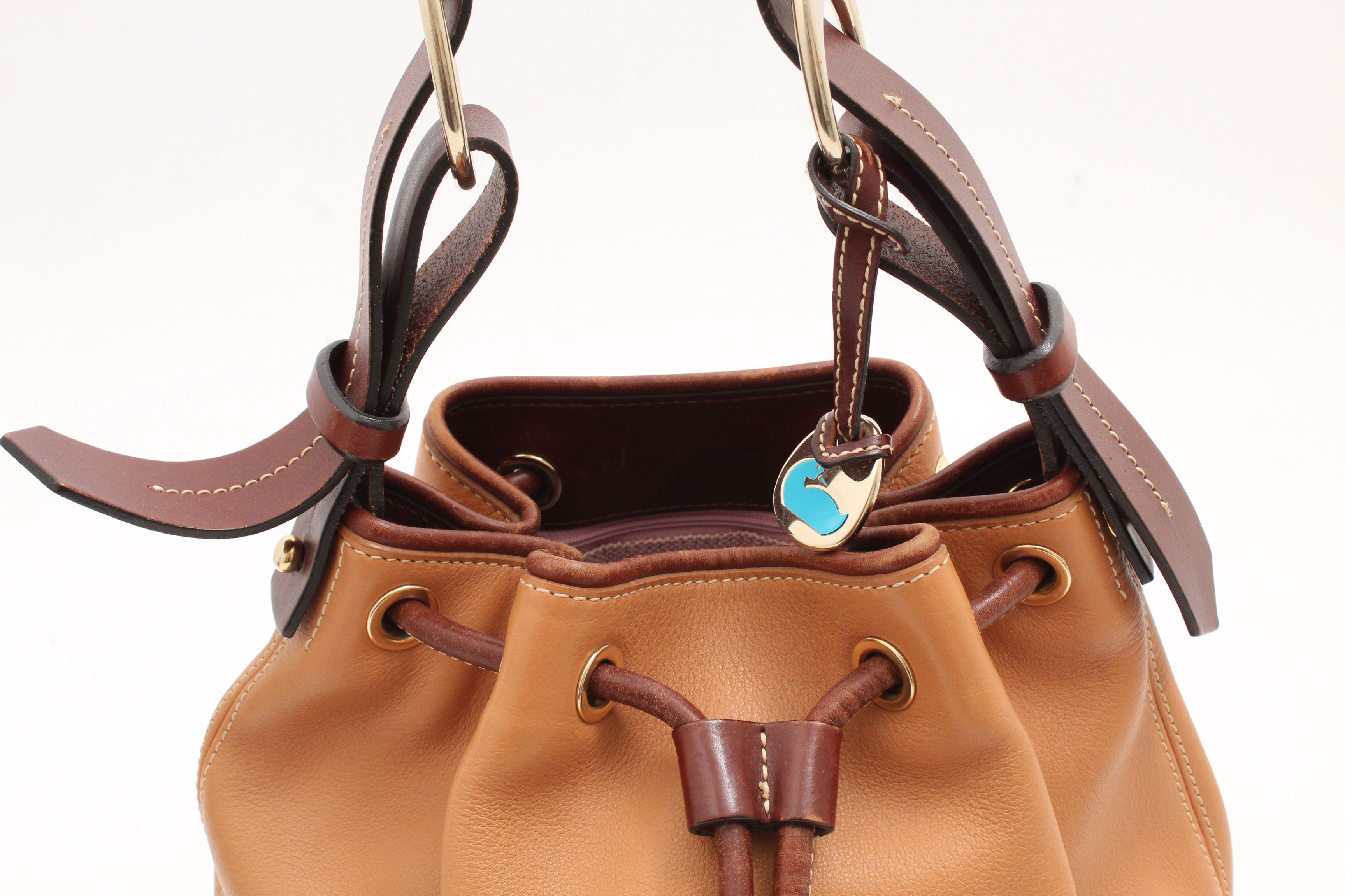 Dooney & Bourke Pebbled Leather Drawstring Bucket Bag in Desert