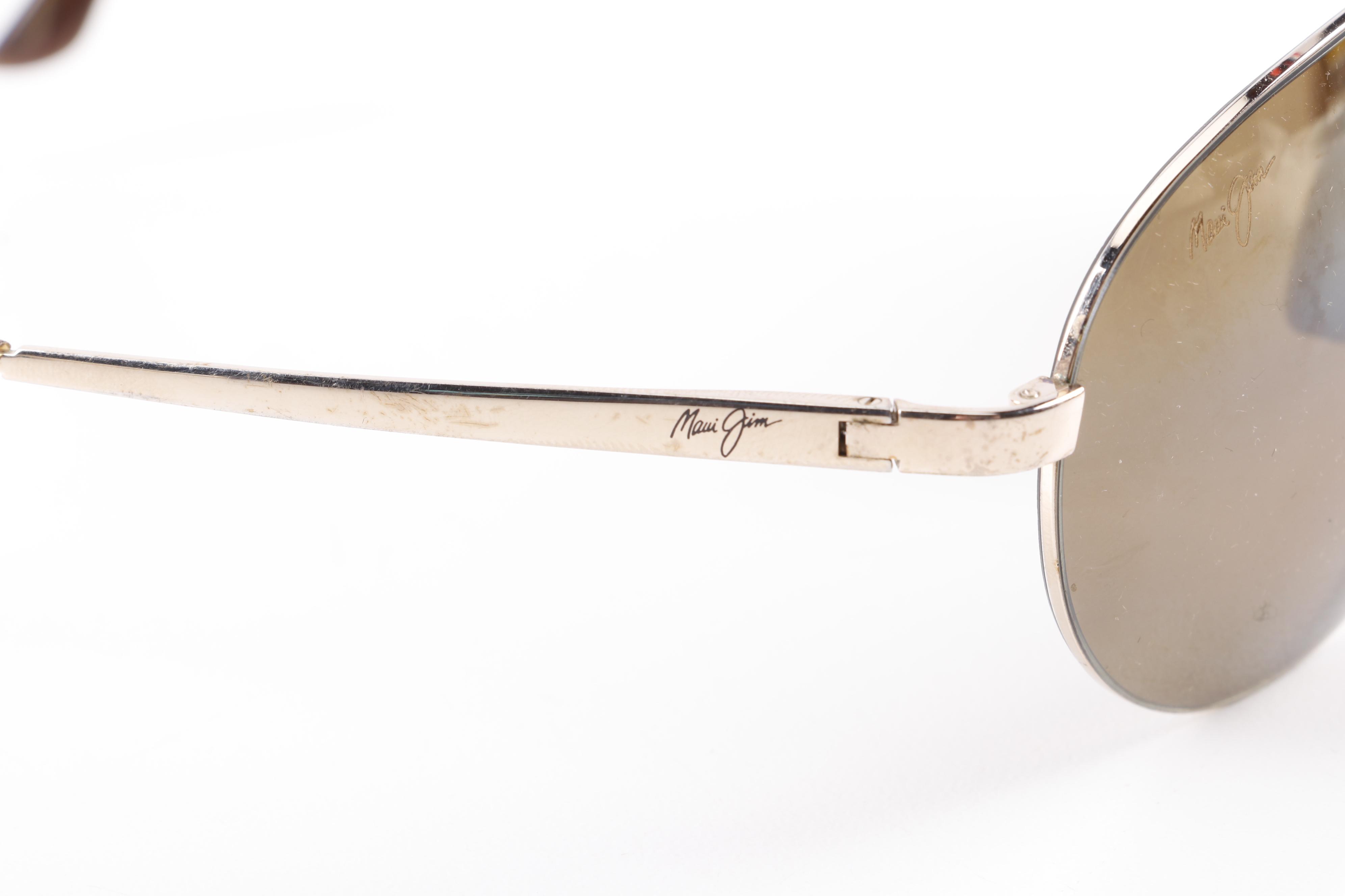 Eyeglasses and Sunglasses by Prada, Ray-Ban, Paul Smith, and Maui Jim