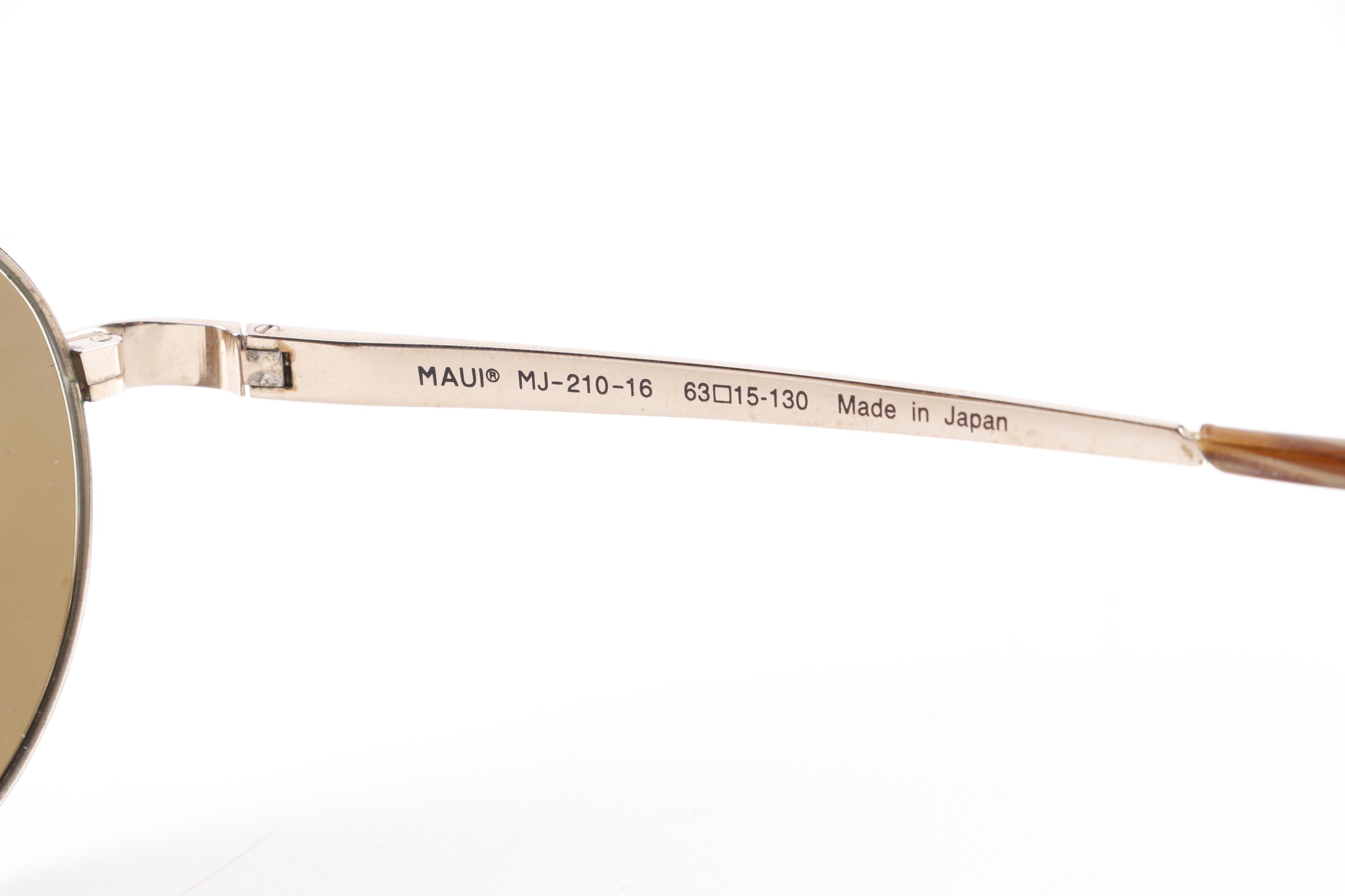 Eyeglasses and Sunglasses by Prada, Ray-Ban, Paul Smith, and Maui Jim