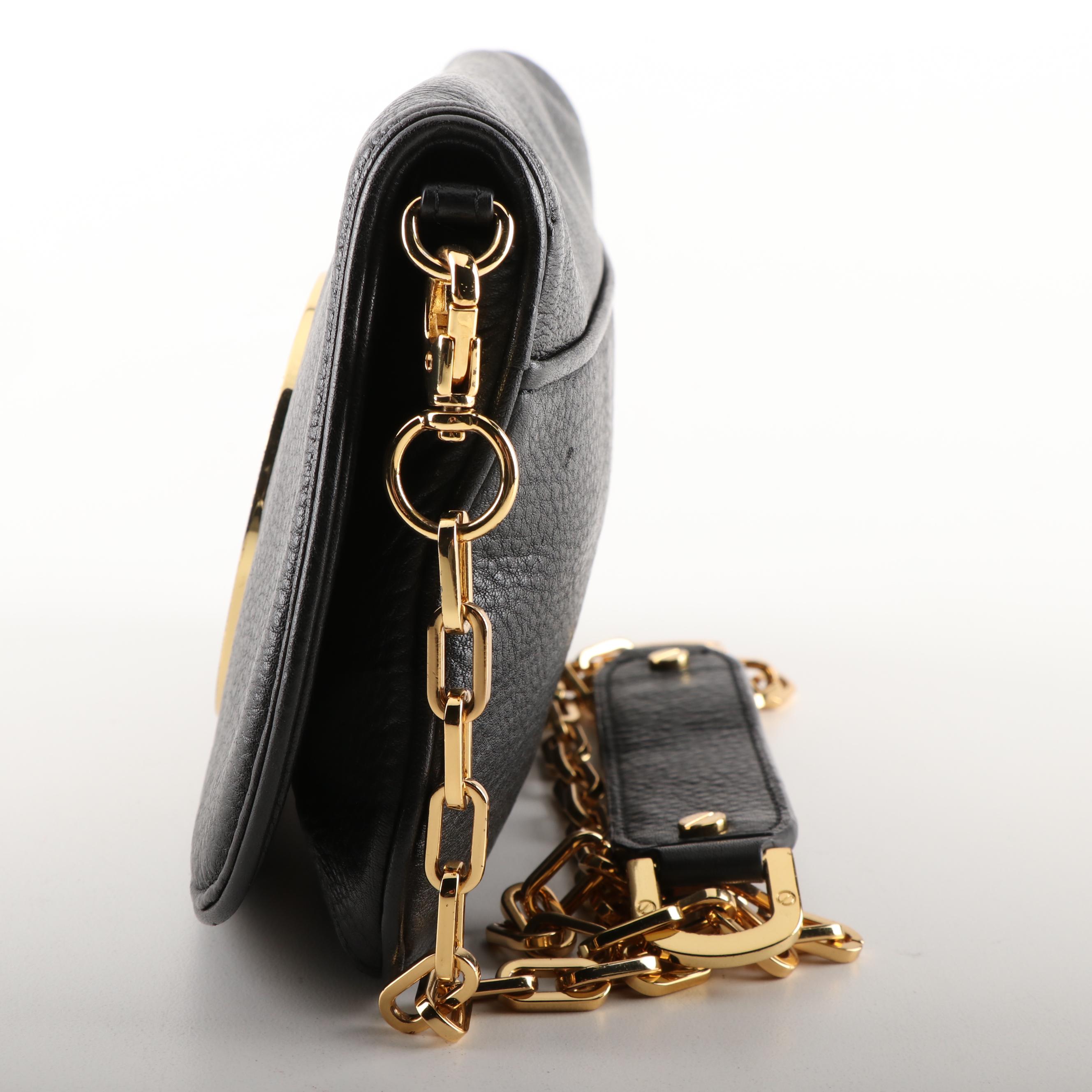 Tory Burch Black Pebble Leather Crossbody and Tory Burch Fitbit Holder Bracelet