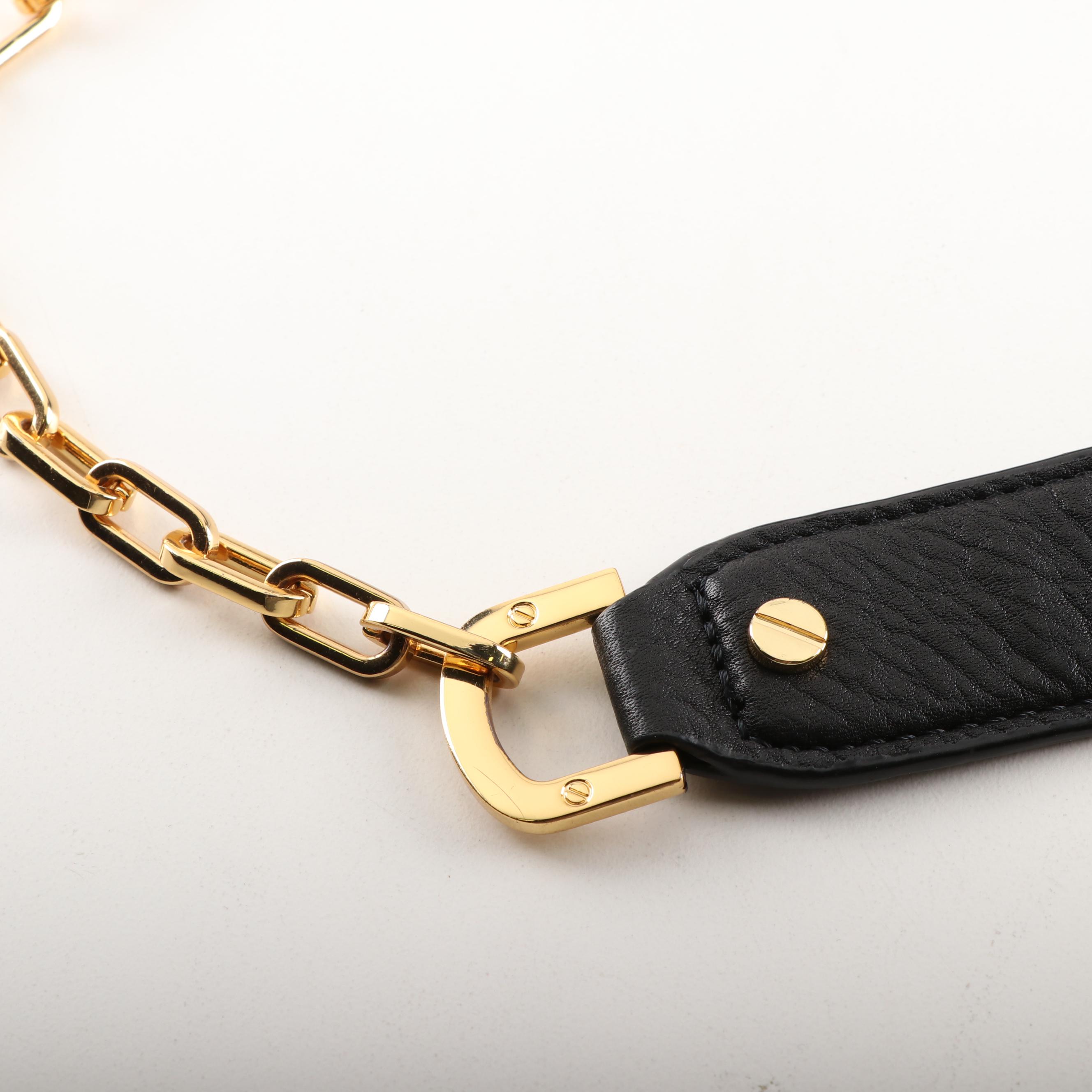 Tory Burch Black Pebble Leather Crossbody and Tory Burch Fitbit Holder Bracelet