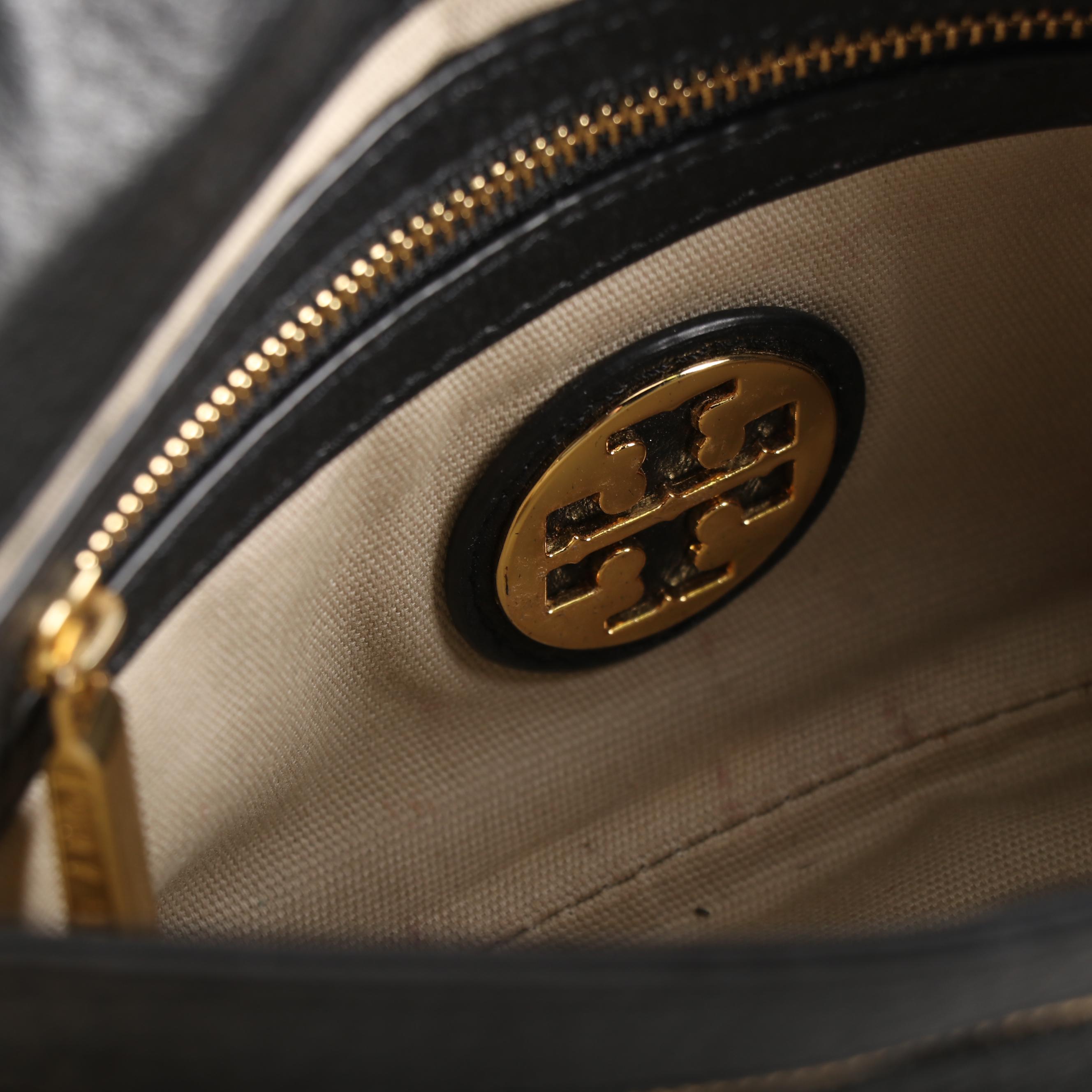 Tory Burch Black Pebble Leather Crossbody and Tory Burch Fitbit Holder Bracelet