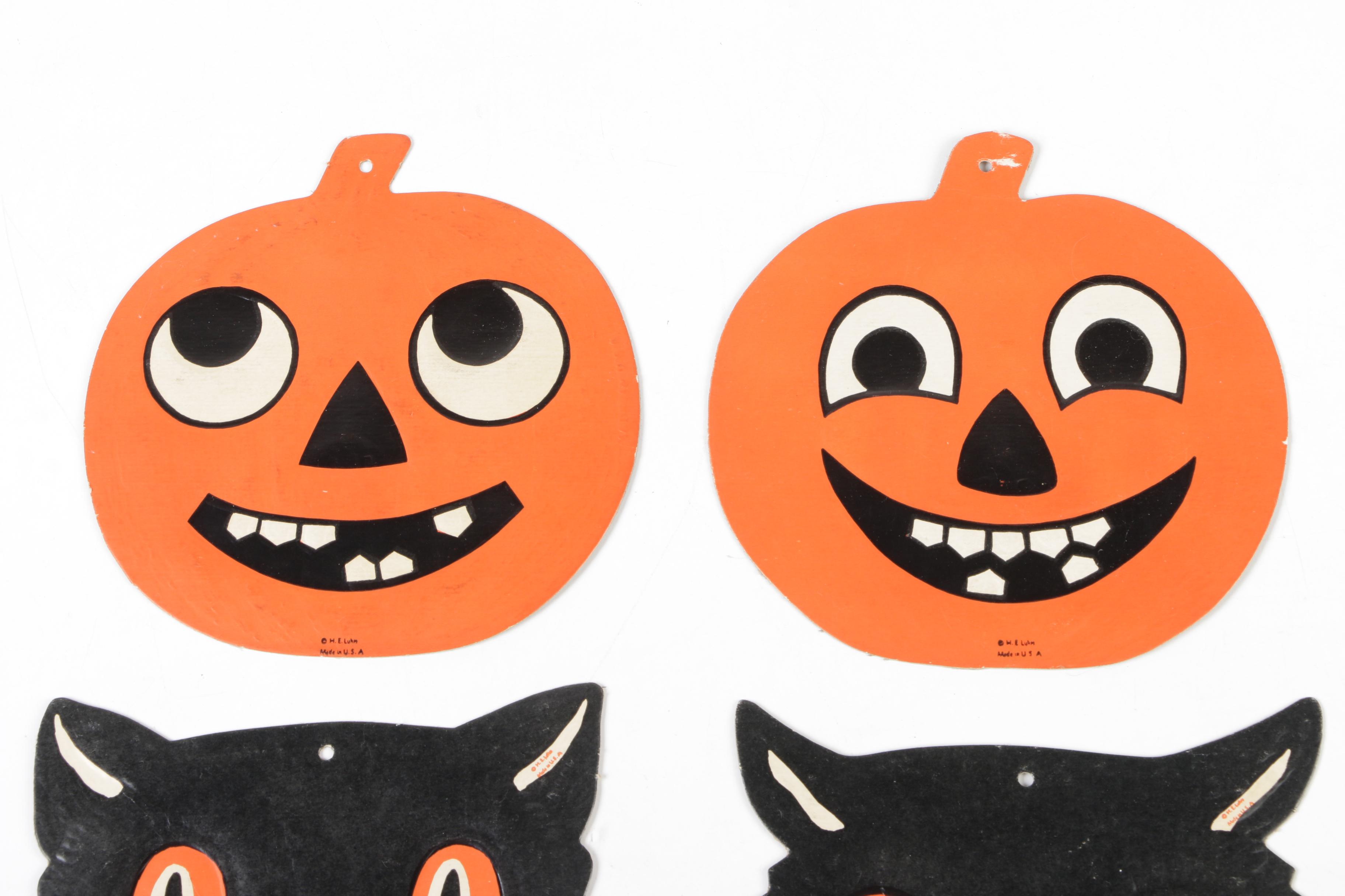 H. E. Luhrs Pressed Cardboard Wall Decorations with Litho Tin Cat Noisemaker