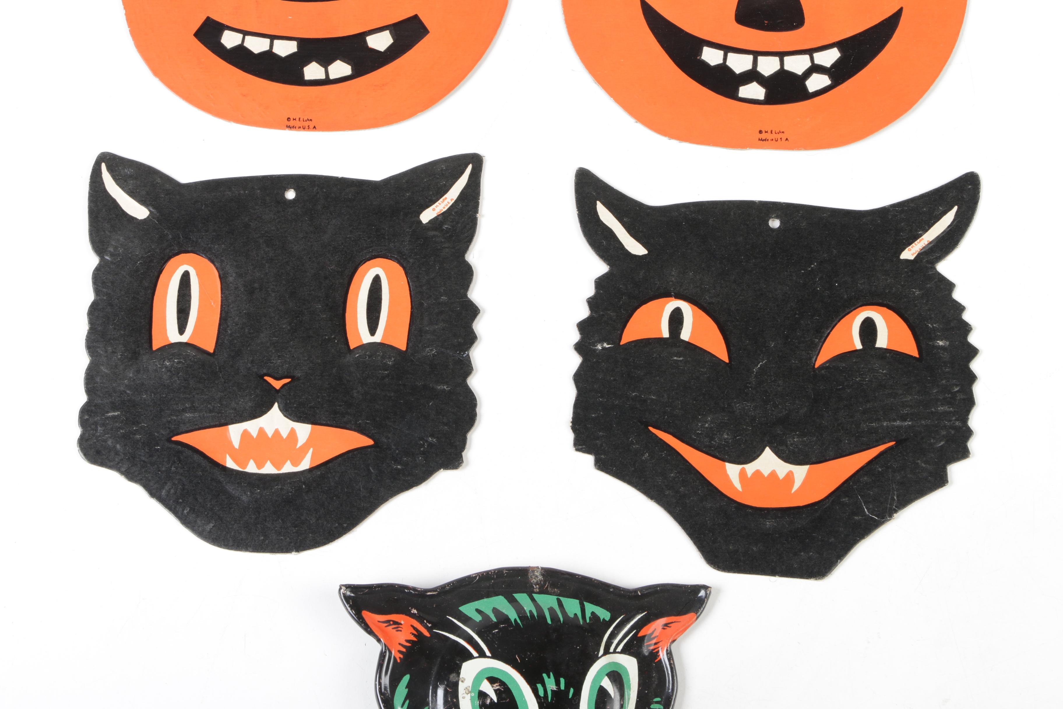 H. E. Luhrs Pressed Cardboard Wall Decorations with Litho Tin Cat Noisemaker