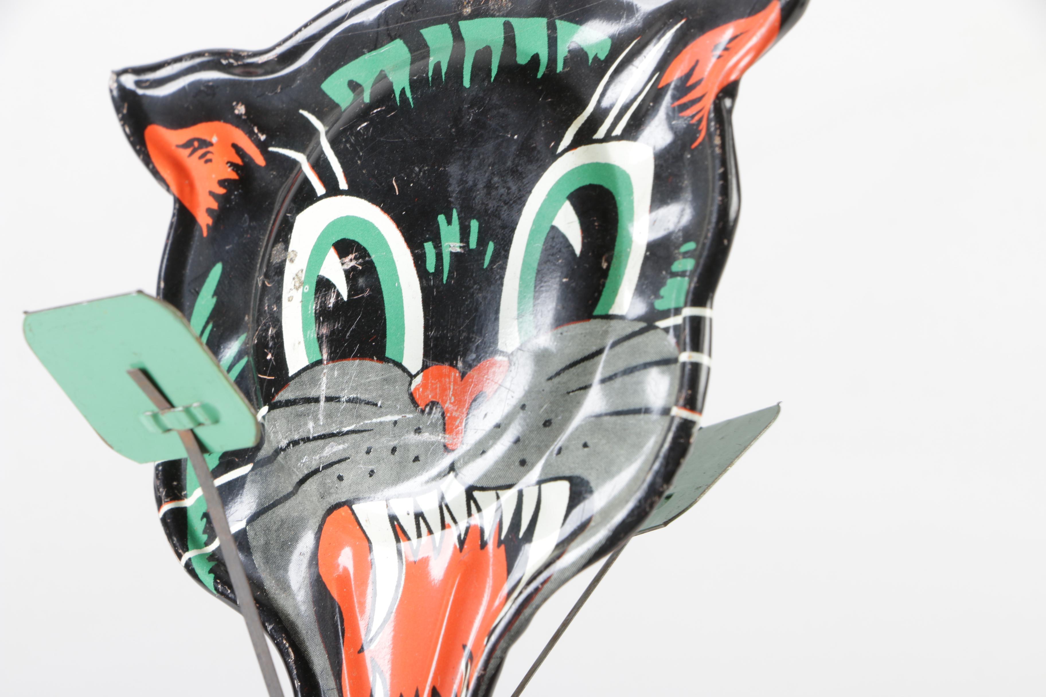 H. E. Luhrs Pressed Cardboard Wall Decorations with Litho Tin Cat Noisemaker