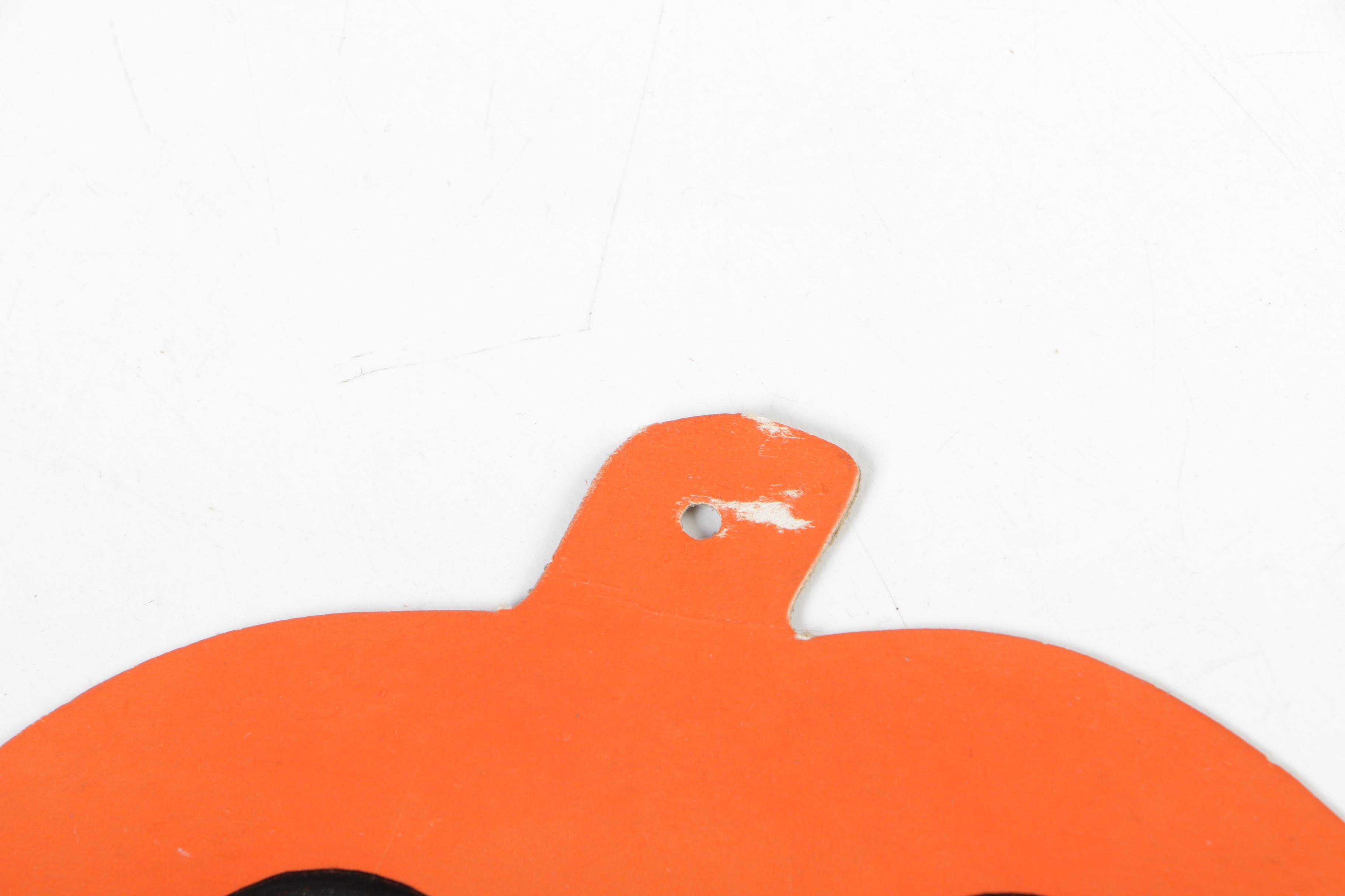 H. E. Luhrs Pressed Cardboard Wall Decorations with Litho Tin Cat Noisemaker