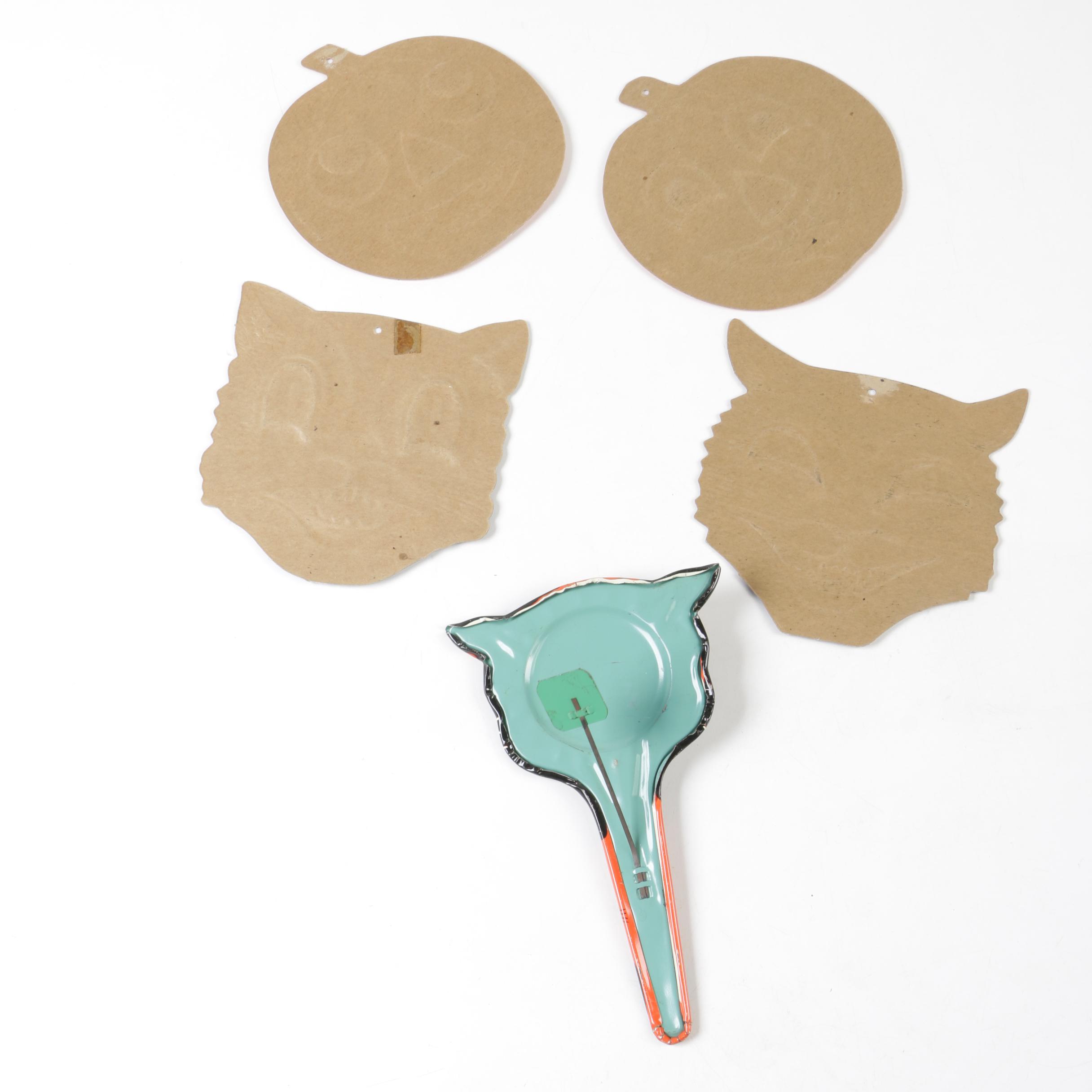 H. E. Luhrs Pressed Cardboard Wall Decorations with Litho Tin Cat Noisemaker
