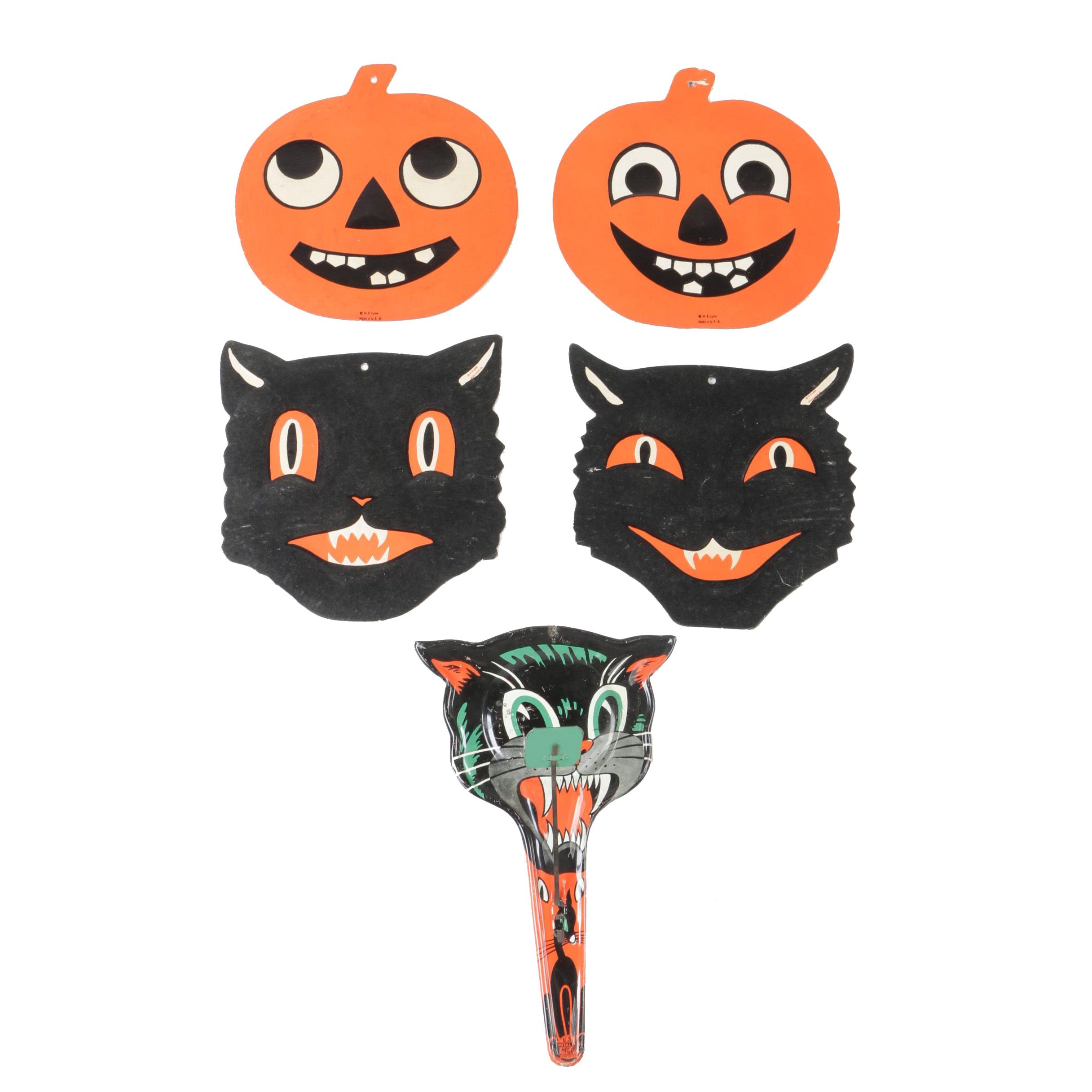 H. E. Luhrs Pressed Cardboard Wall Decorations with Litho Tin Cat Noisemaker