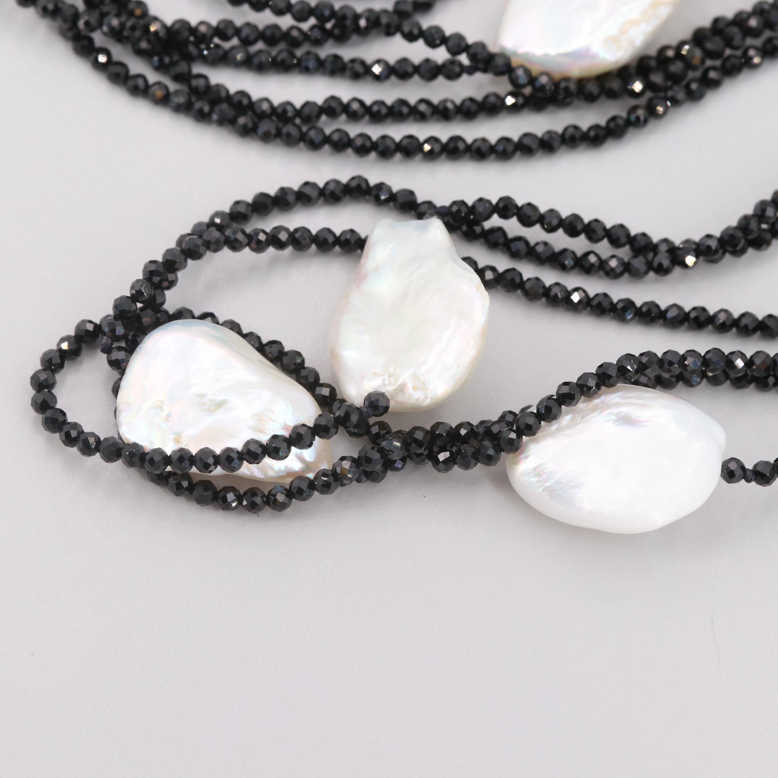 Cultured Pearl and Synthetic Black Spinel Triple-Stranded Necklace