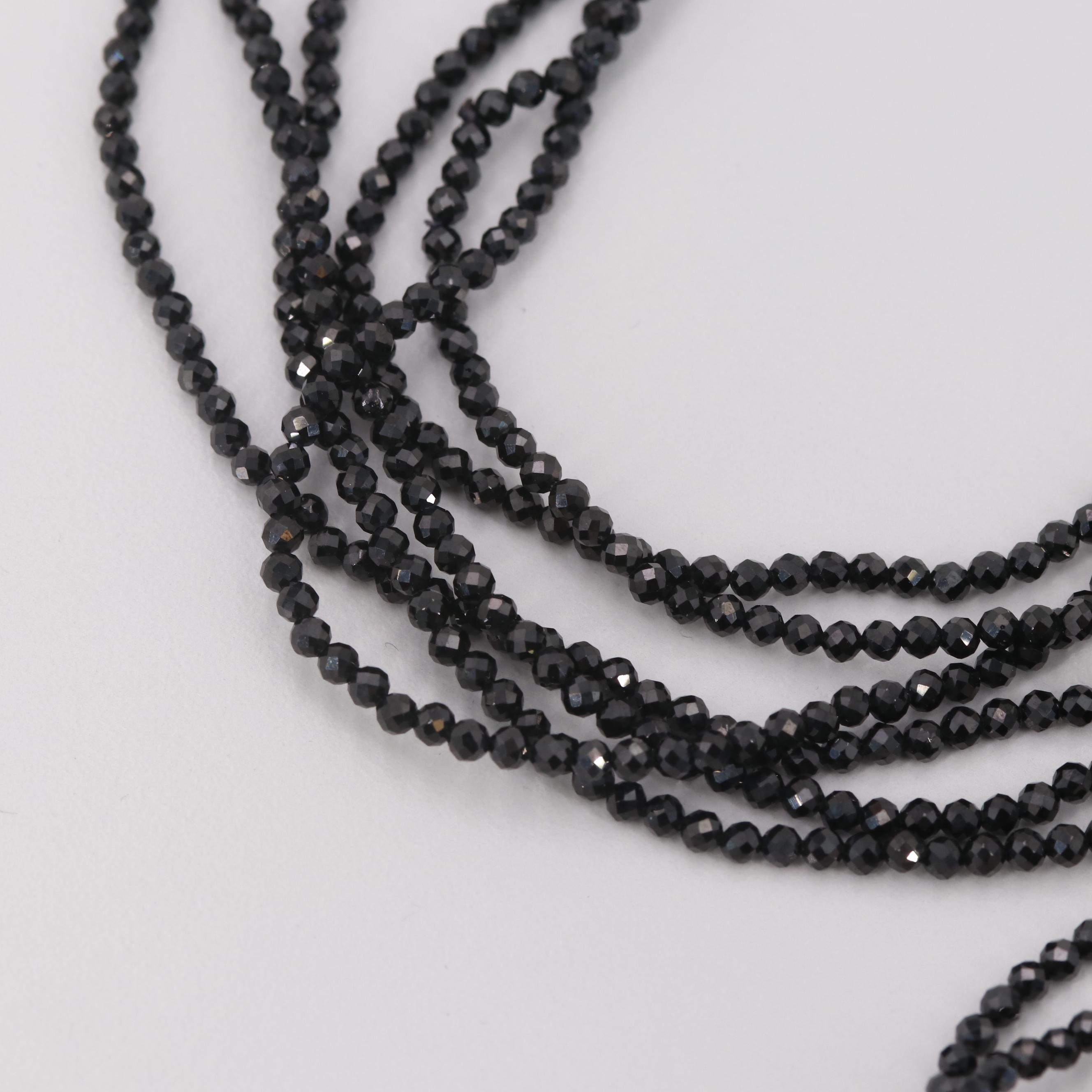 Cultured Pearl and Synthetic Black Spinel Triple-Stranded Necklace