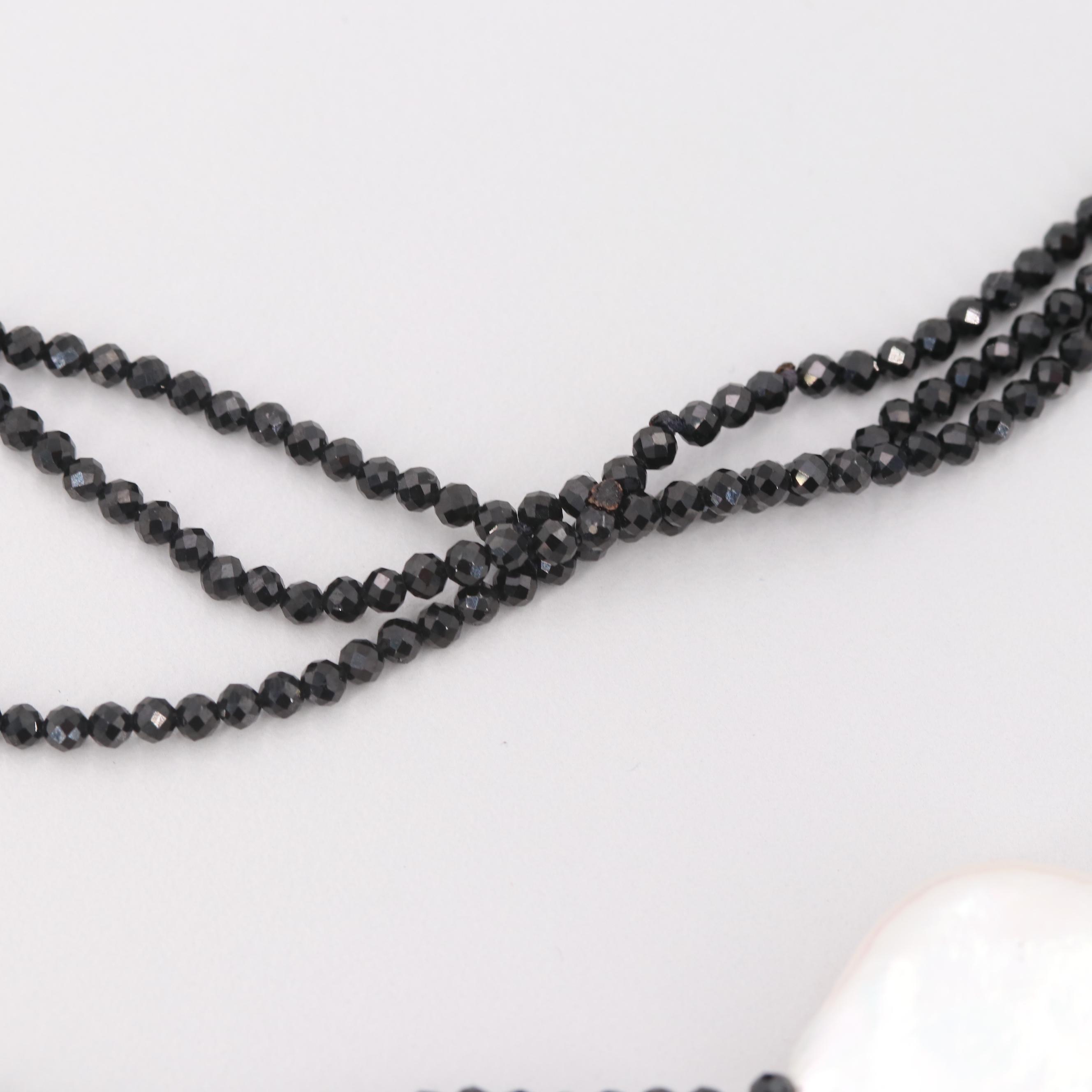 Cultured Pearl and Synthetic Black Spinel Triple-Stranded Necklace