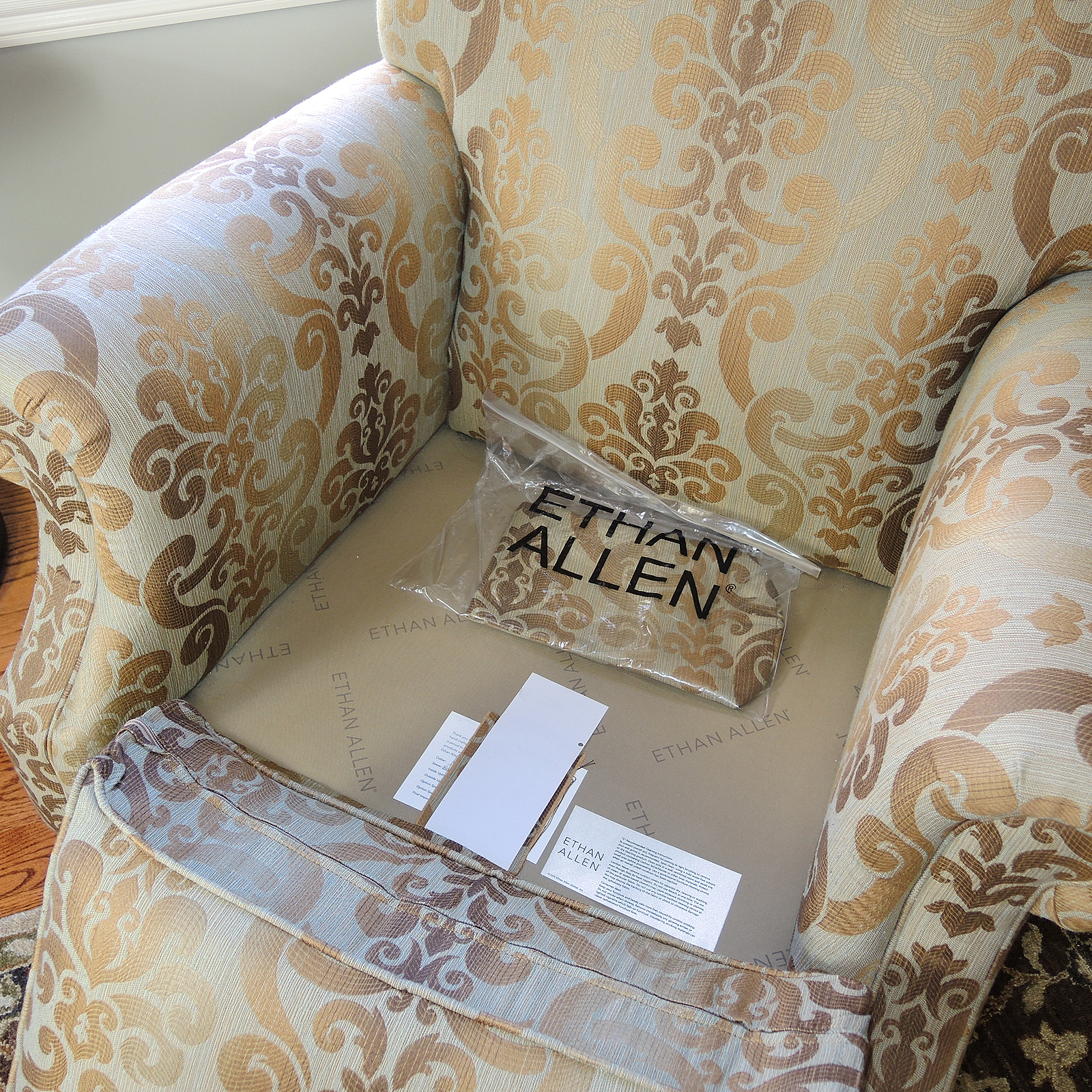 Ethan Allen Upholstered Arm Chair and Ottoman