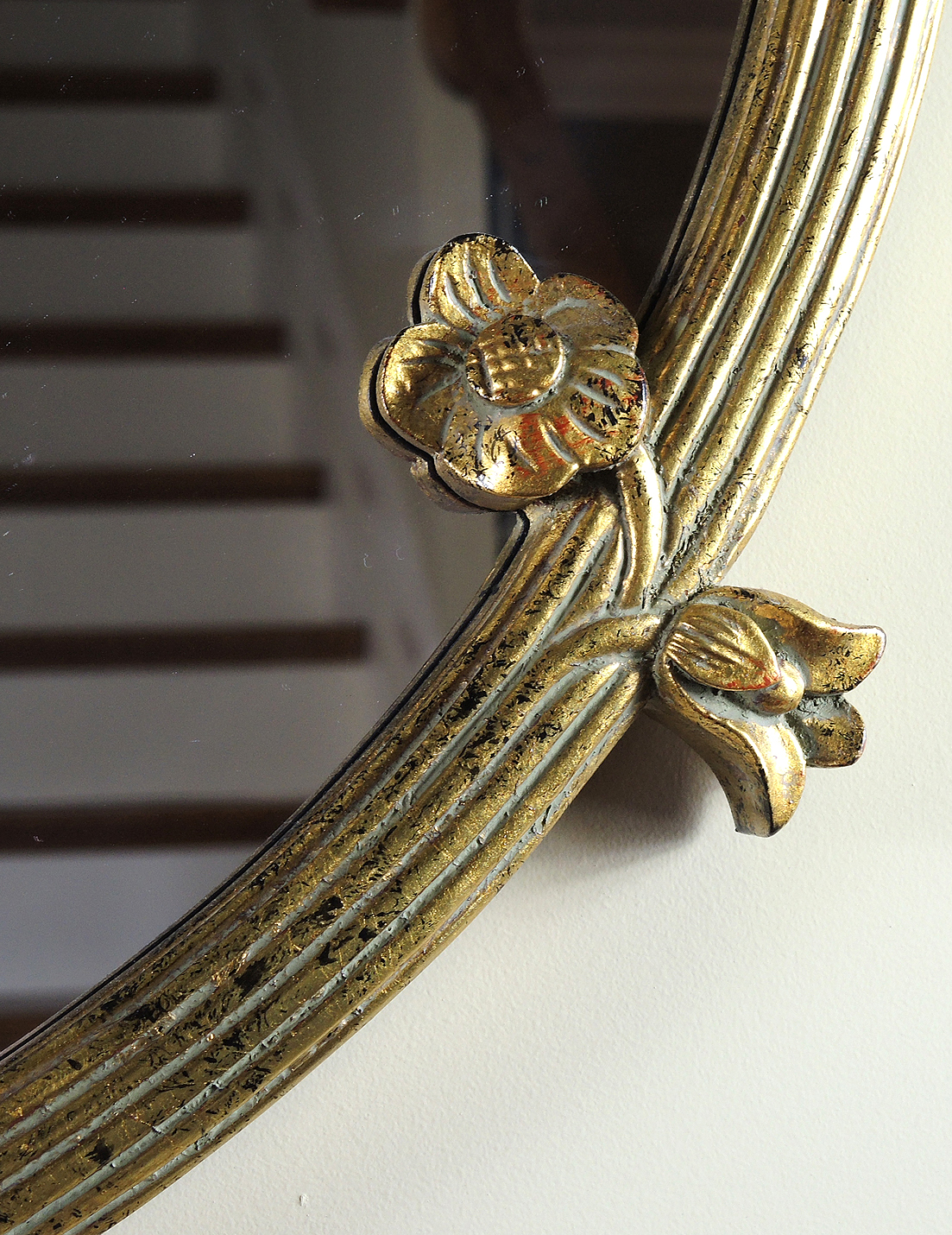 Round Wall Mirror with Floral Accents in Gold Tone Finish