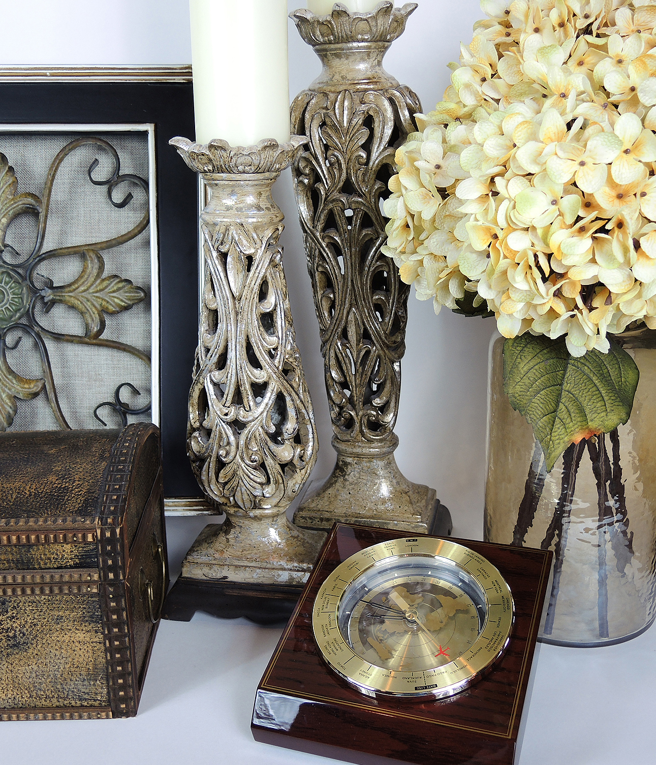 Table Decor Including an Armillary Sphere and Candlestick Lamp