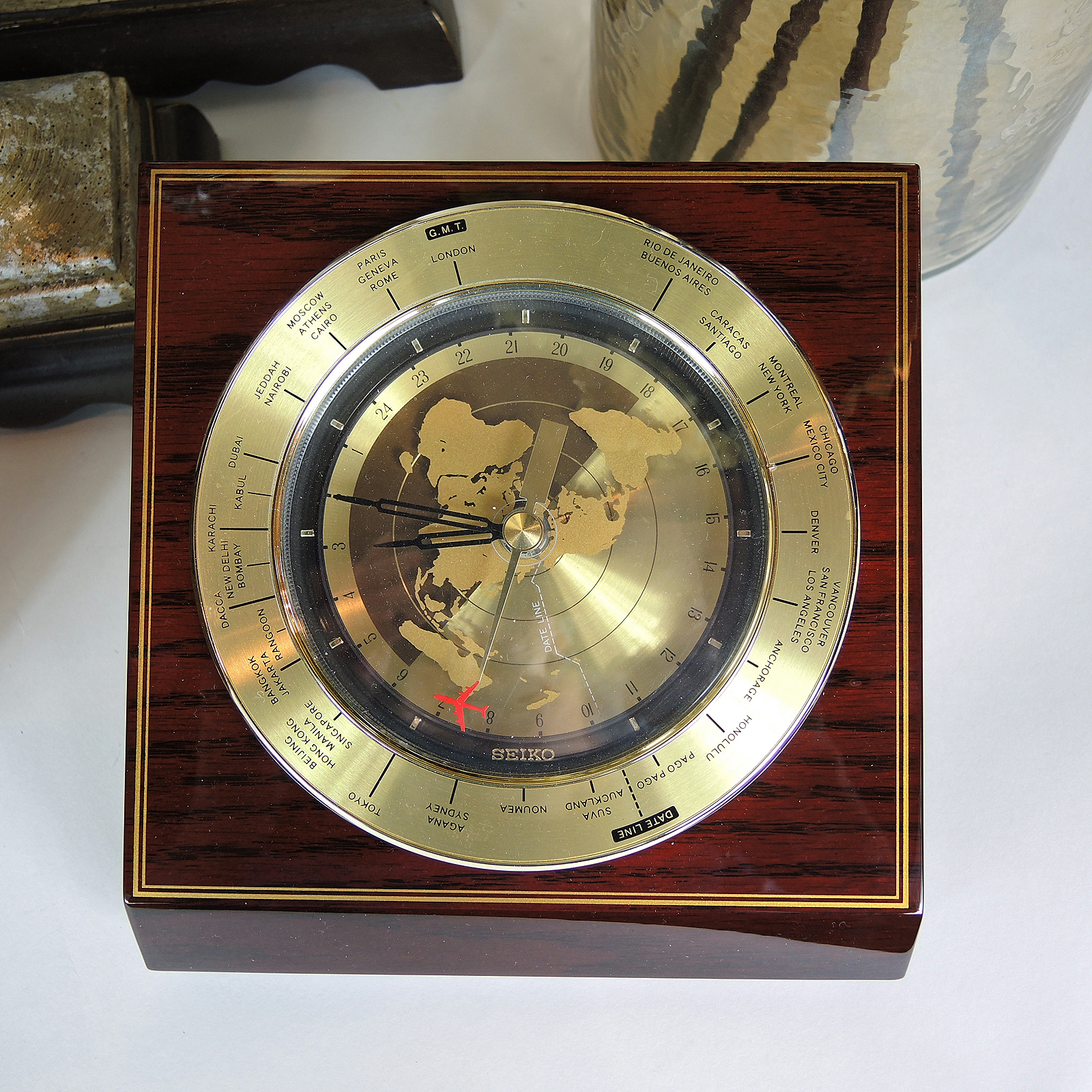 Table Decor Including an Armillary Sphere and Candlestick Lamp