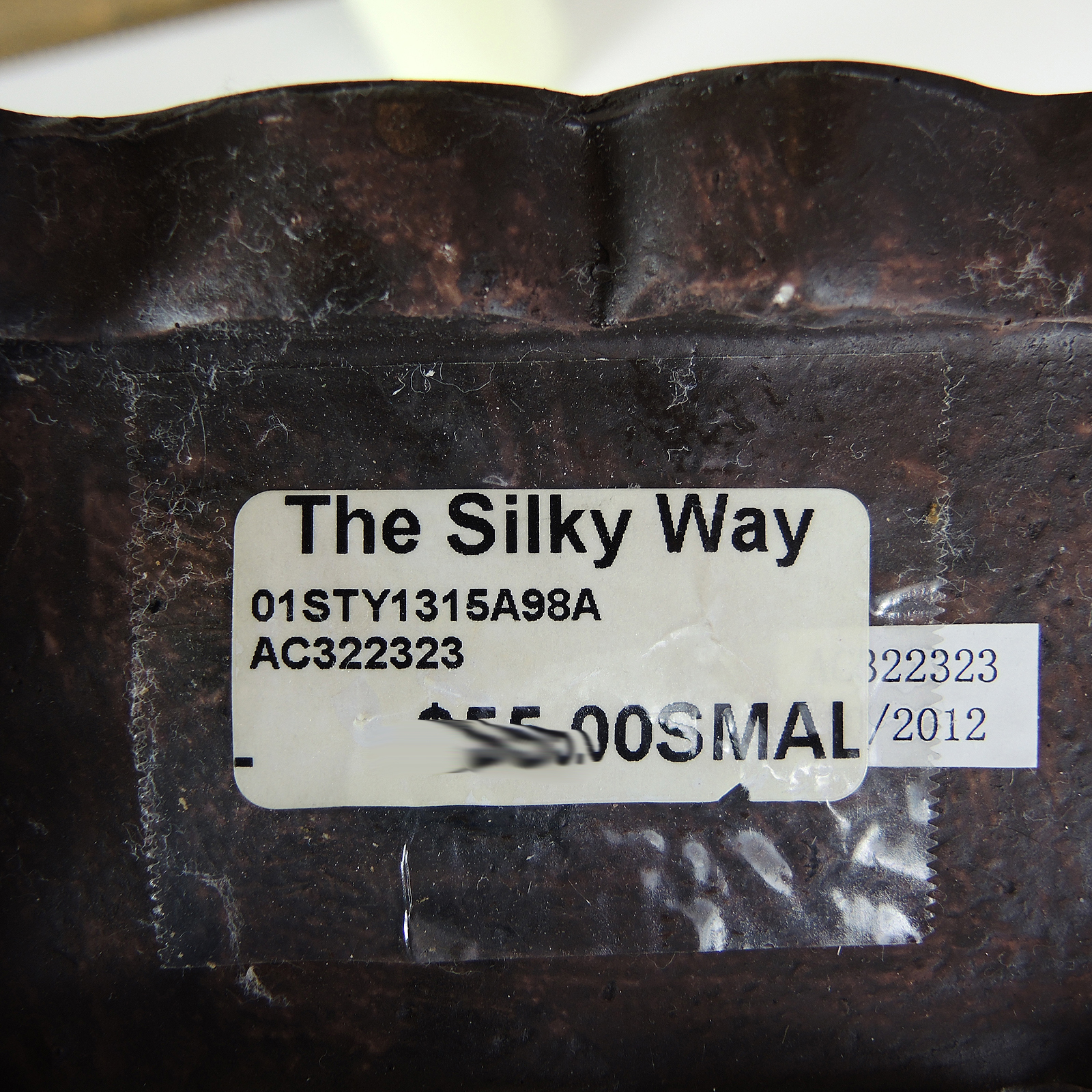 Table Decor Including an Armillary Sphere and Candlestick Lamp