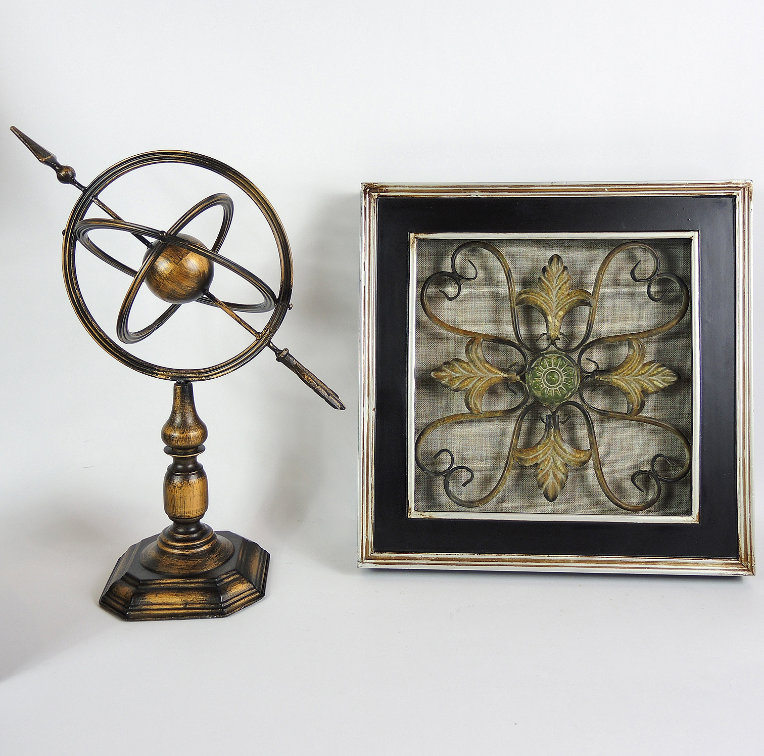 Table Decor Including an Armillary Sphere and Candlestick Lamp