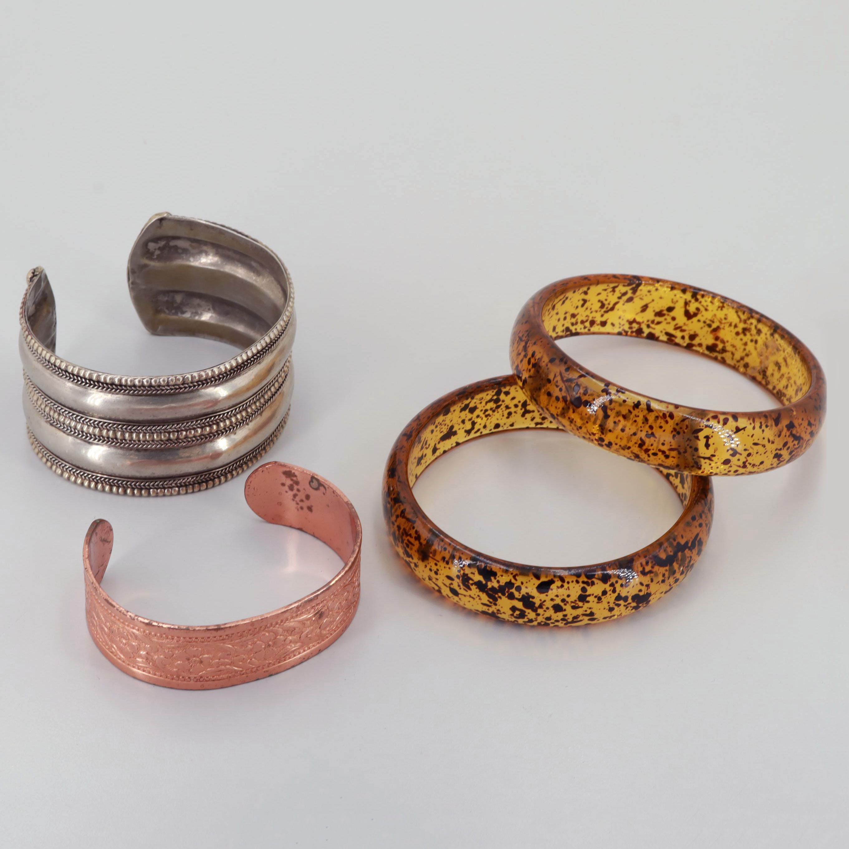 Silver Tone, Resin, and Copper Bracelets Featuring Cuff and Bangle Styles
