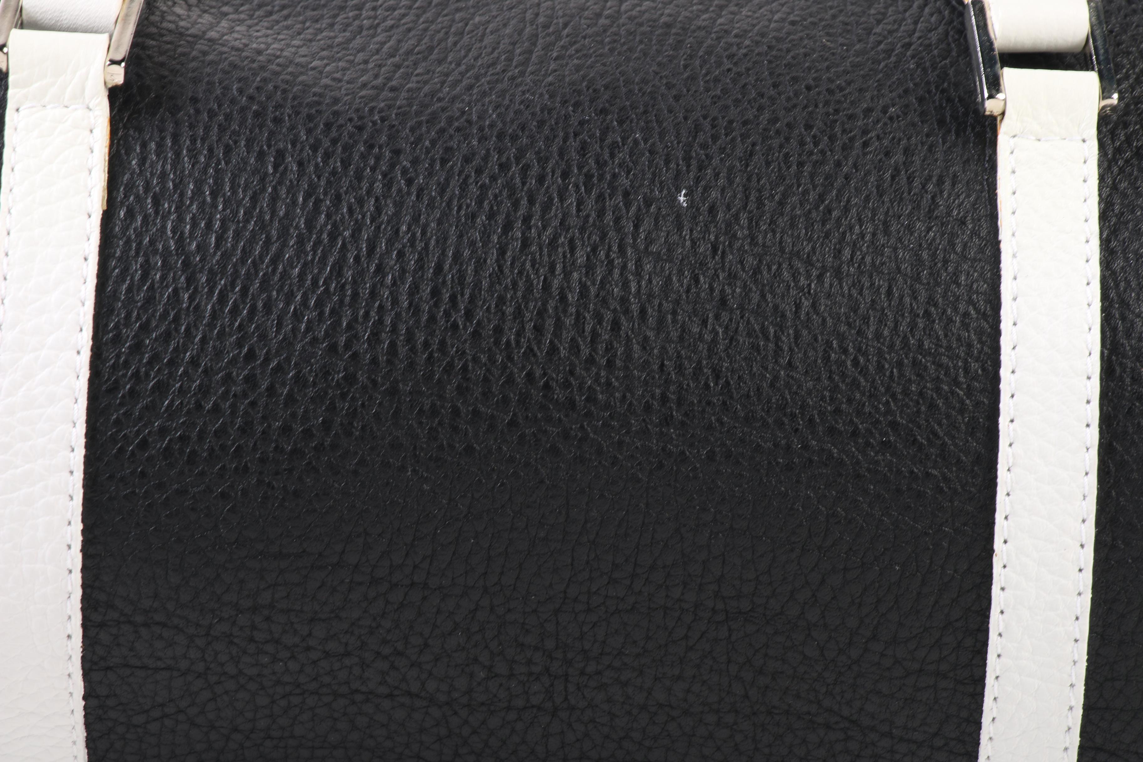 Tanner Barrel Bag in Black Pebbled Leather with White Leather Straps