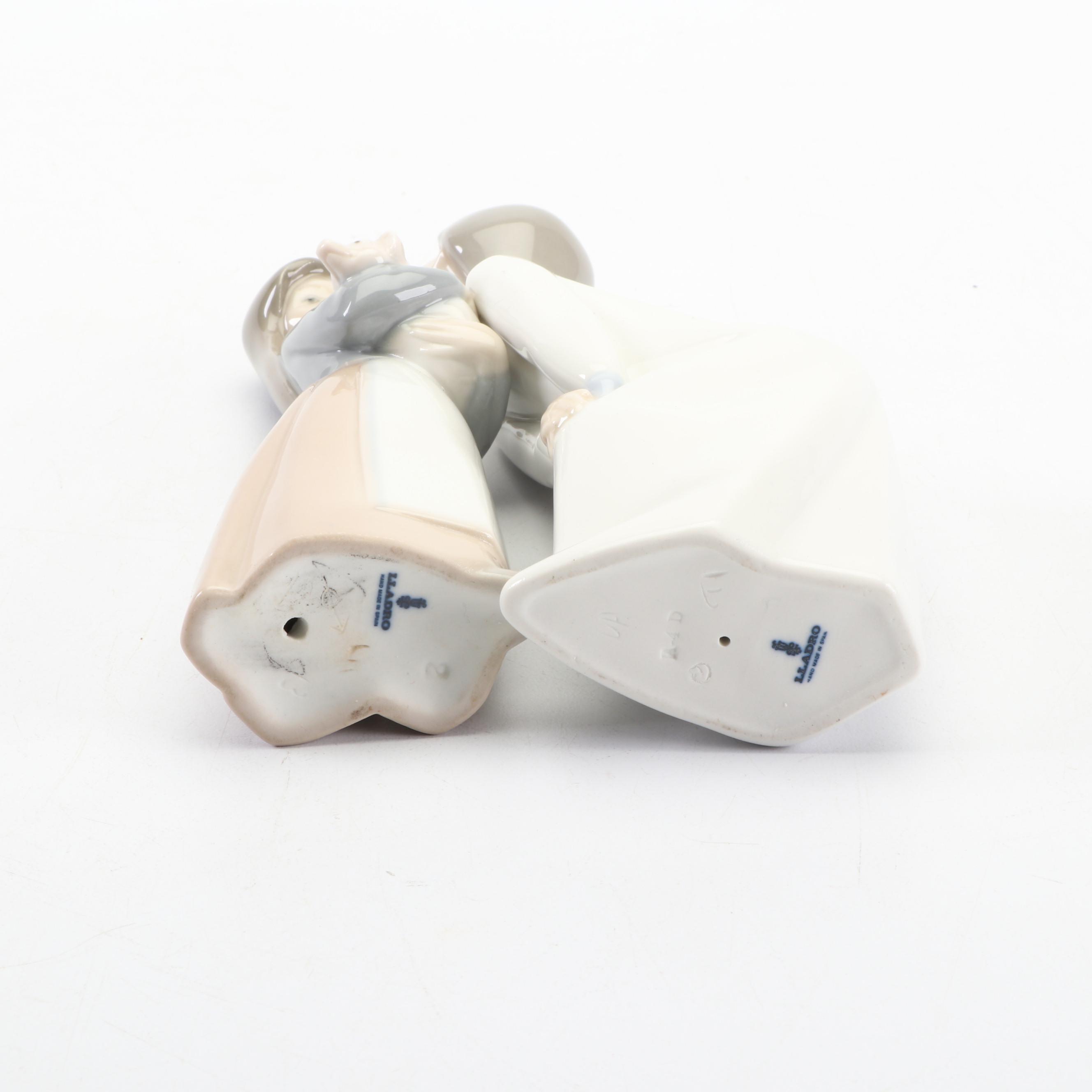 Lladró Girl Holding Piglet and Kissing Girl Figurines , 1970s