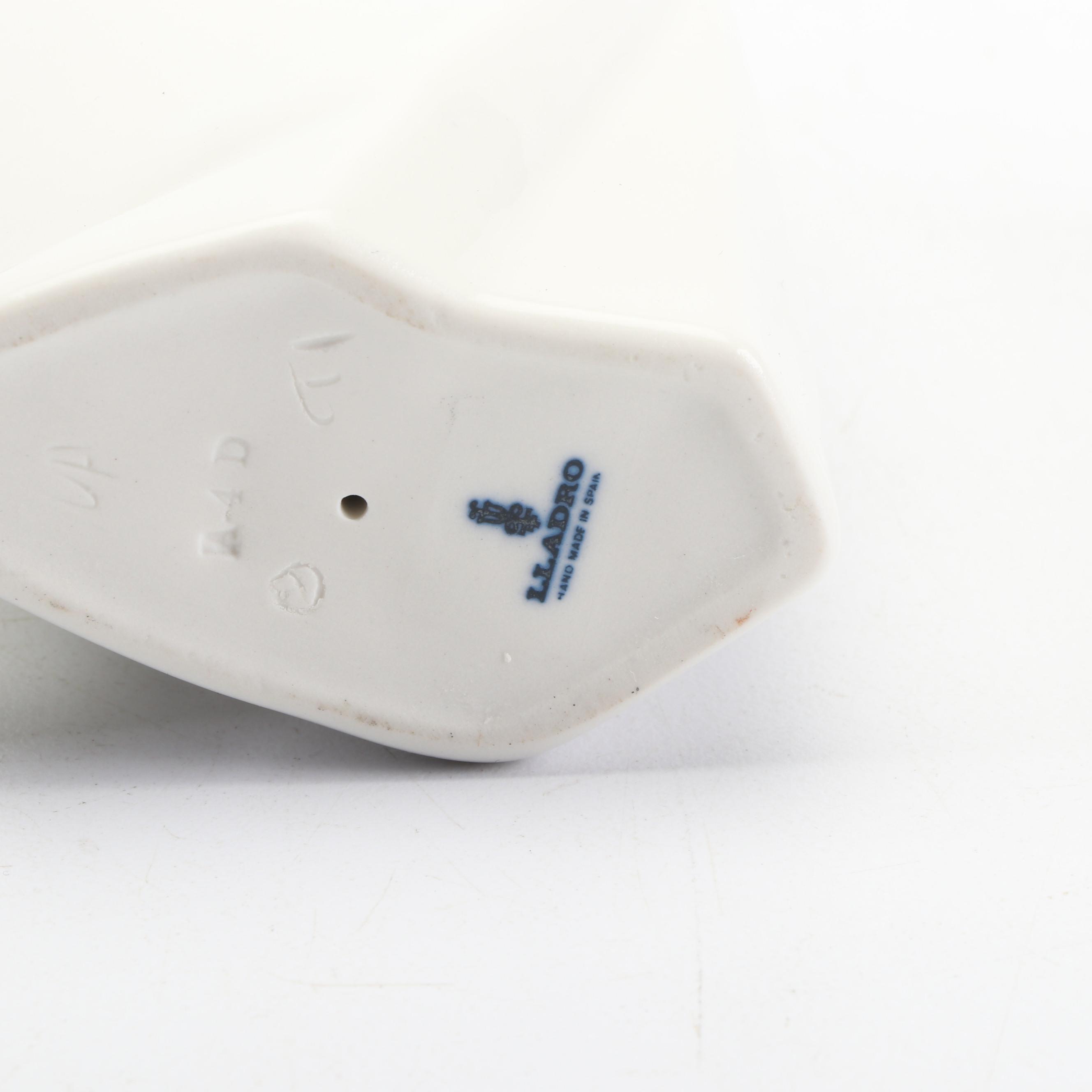 Lladró Girl Holding Piglet and Kissing Girl Figurines , 1970s