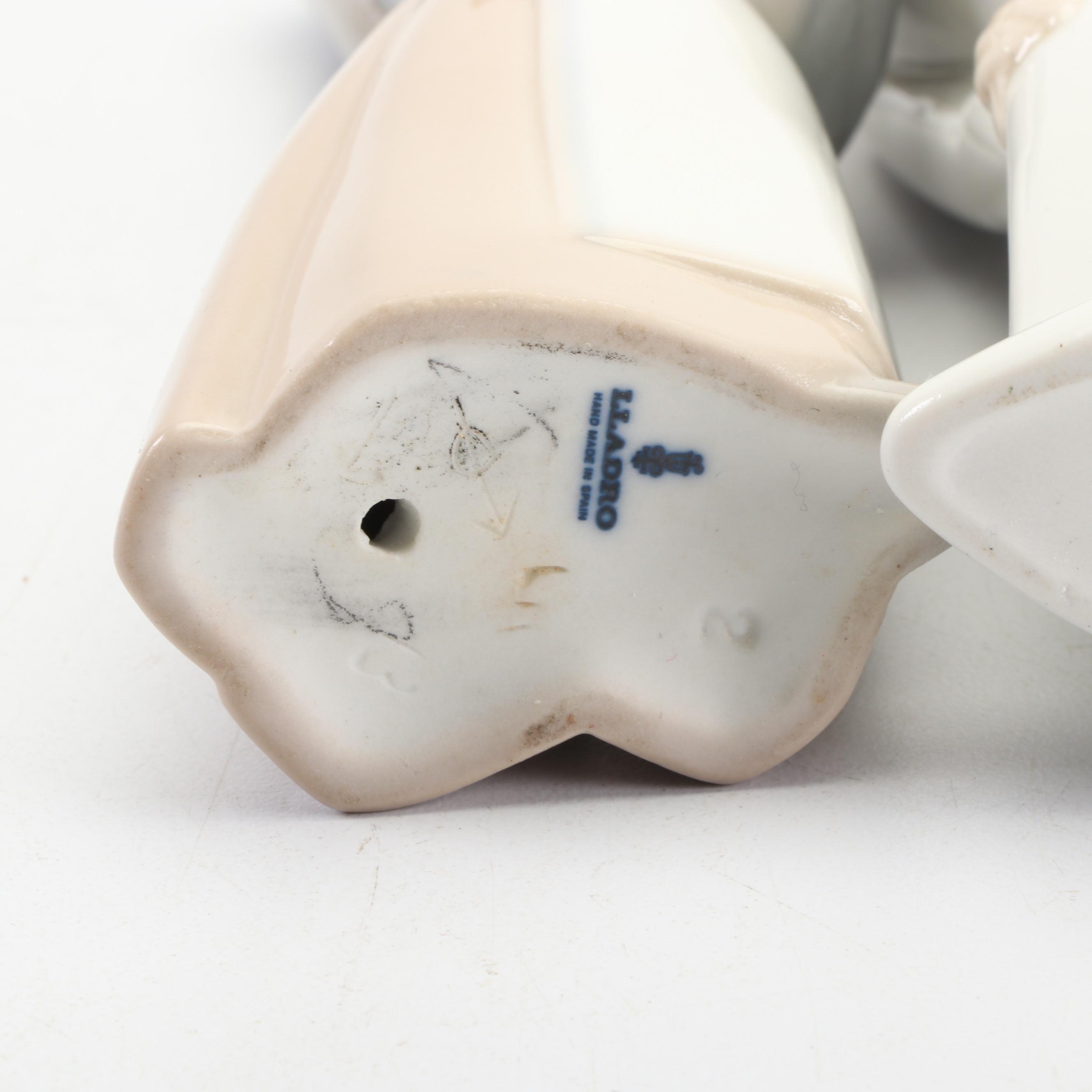 Lladró Girl Holding Piglet and Kissing Girl Figurines , 1970s