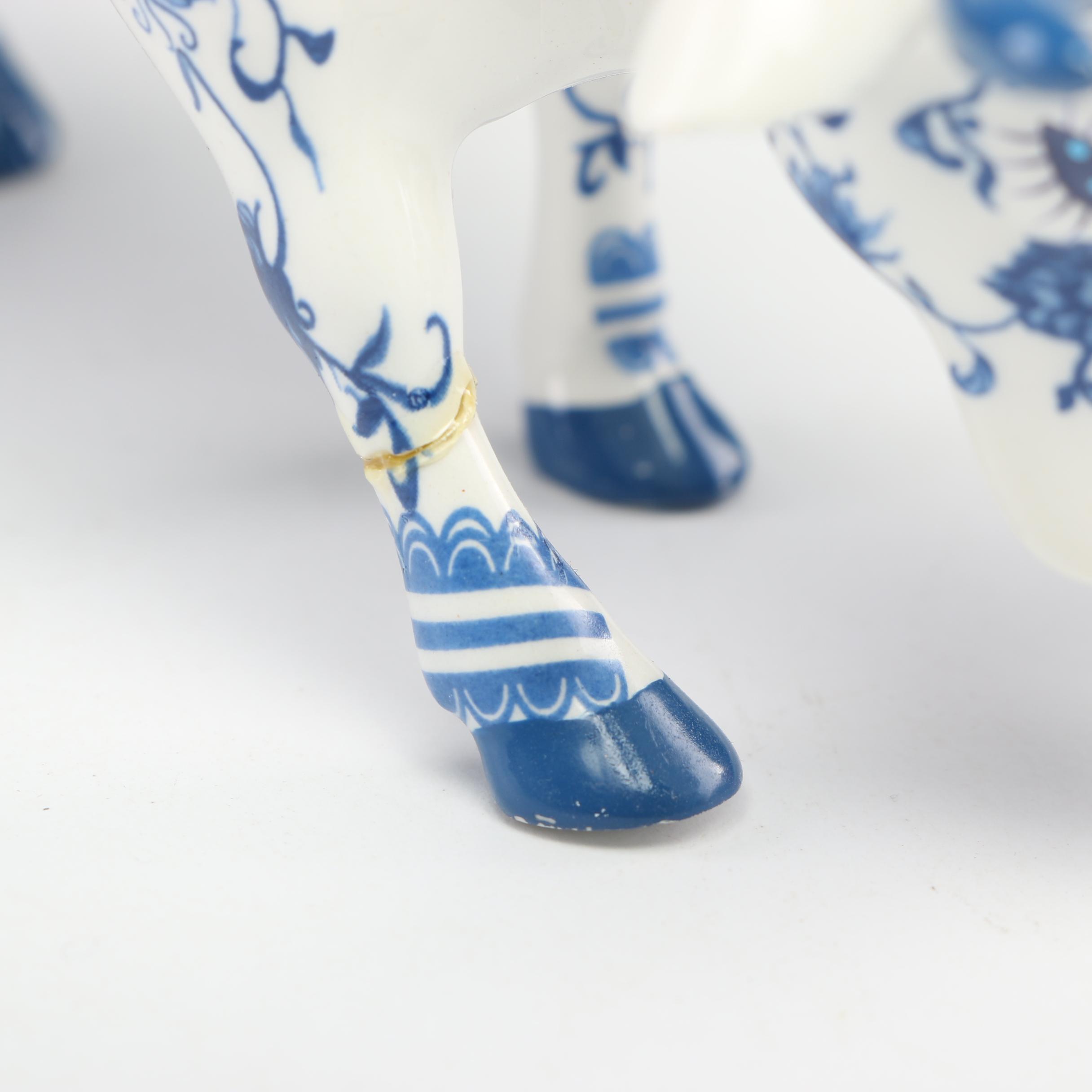 Cow Parade Figurines and Bookends Including "MooShoe" and "AngeliCow"